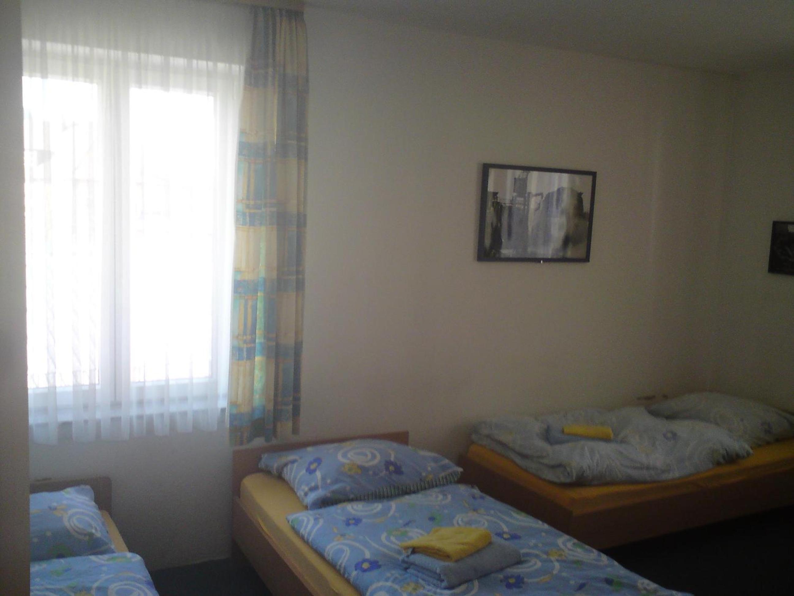 Basic Triple Room with Shared Bathroom - Photo 1