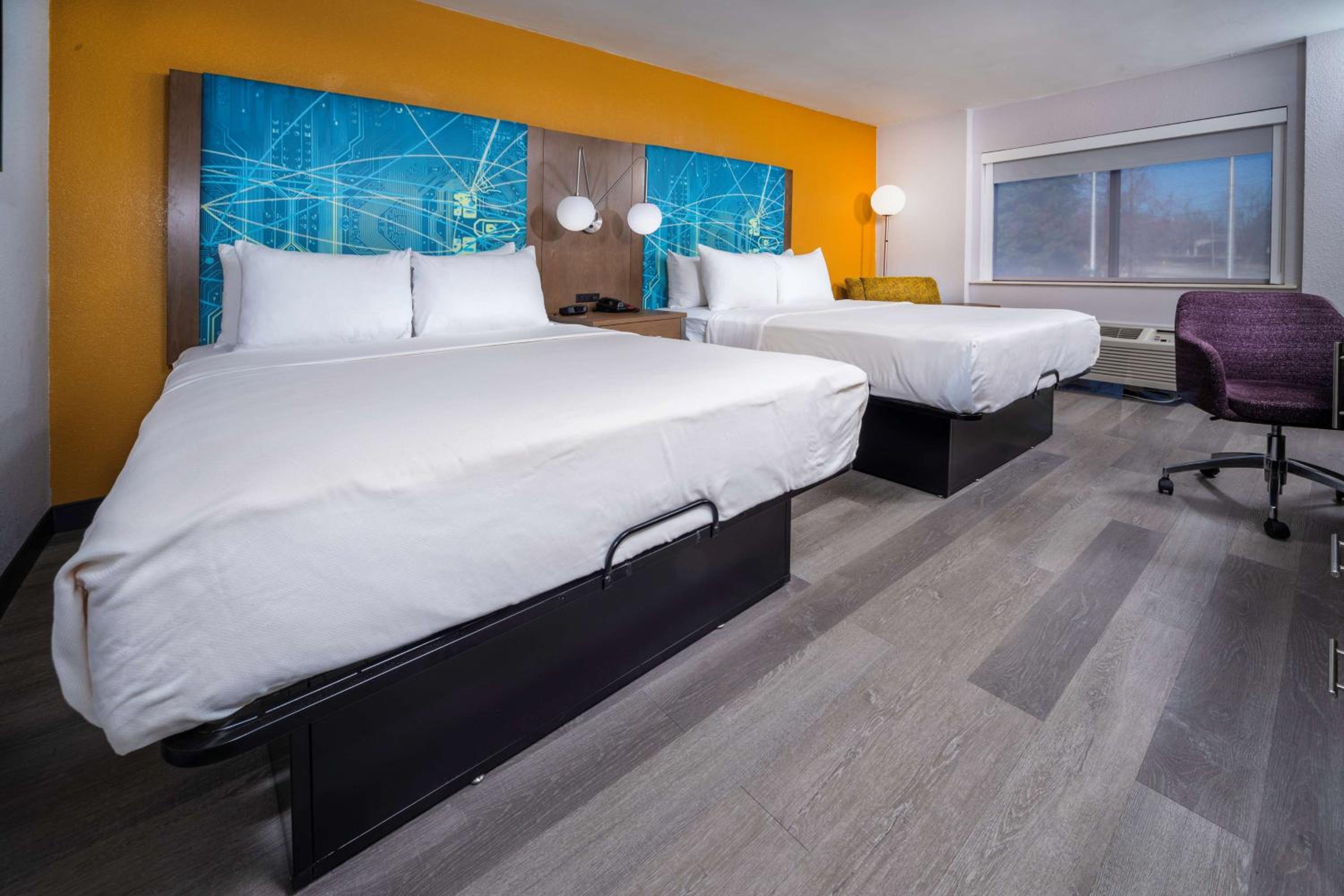 Queen Suite with Two Queen Beds and Sofa Bed - Photo 1