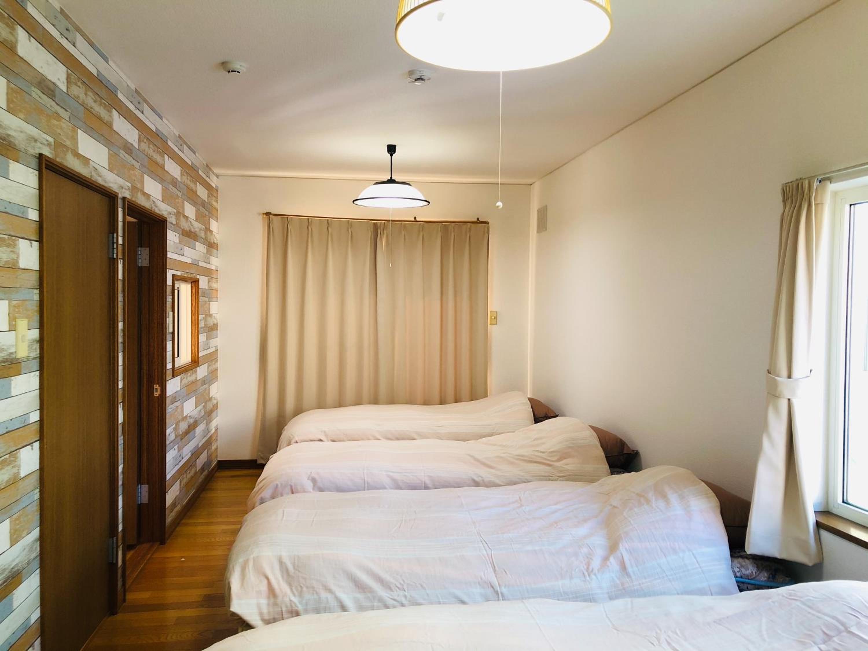 Four-Bedroom House - Photo 22