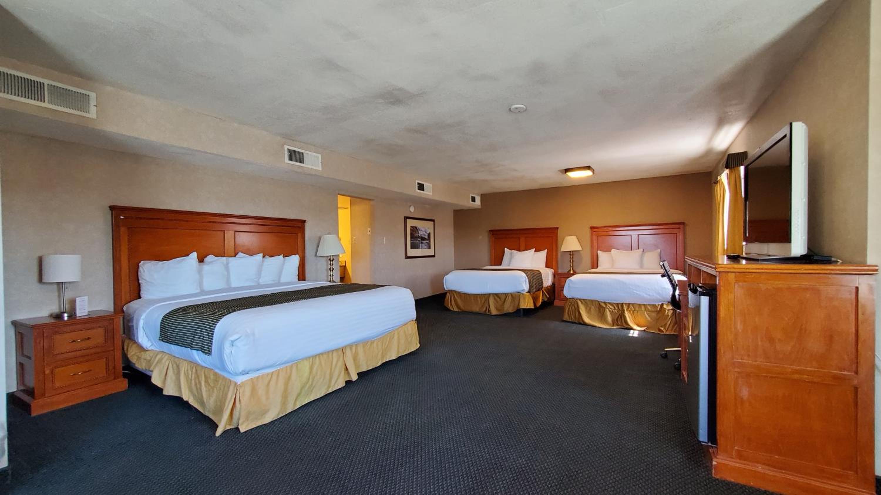 One-Bedroom Suite with 3 Queen Beds, Non-Smoking - Photo 1