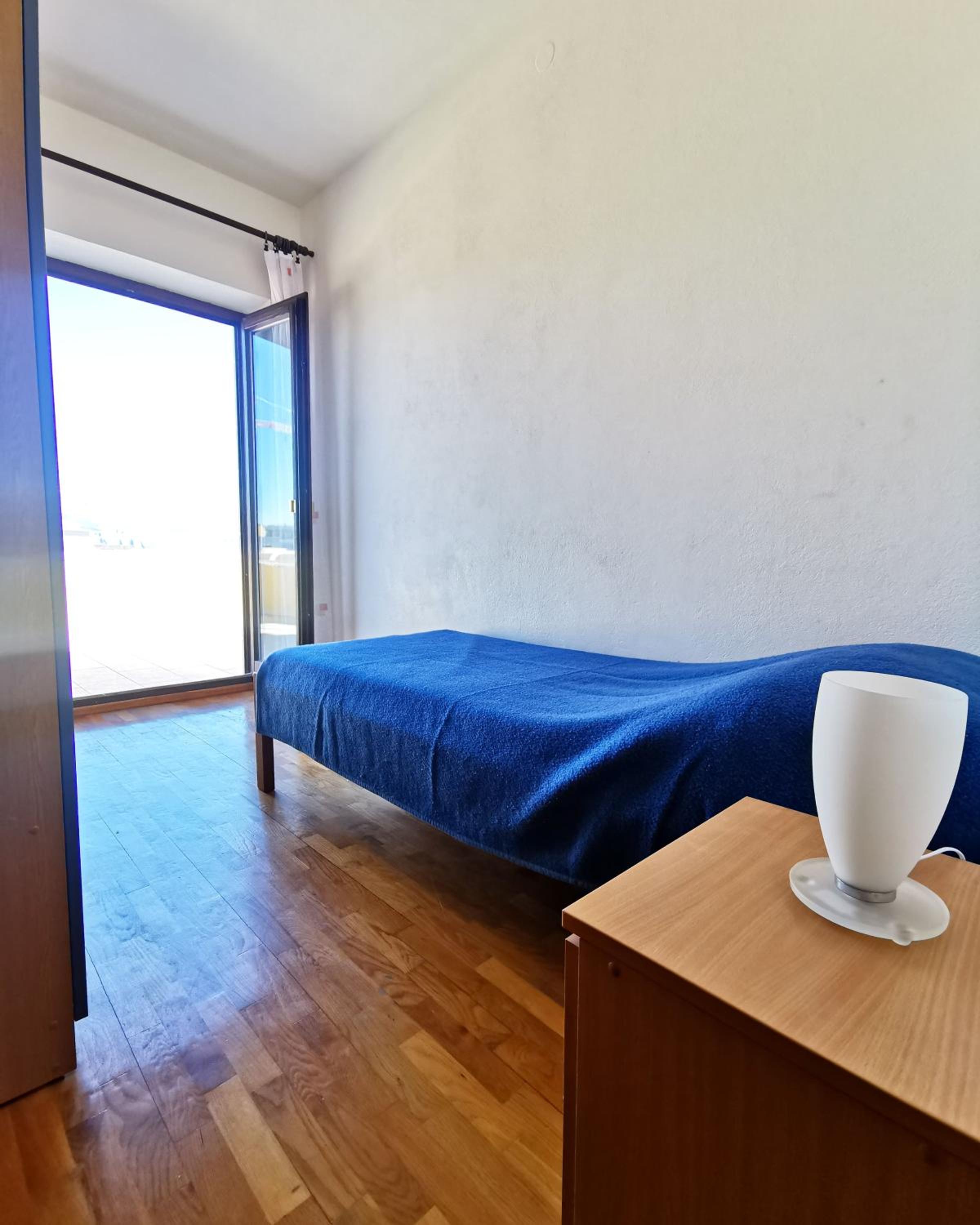 Three-Bedroom Apartment with Terrace and Sea View