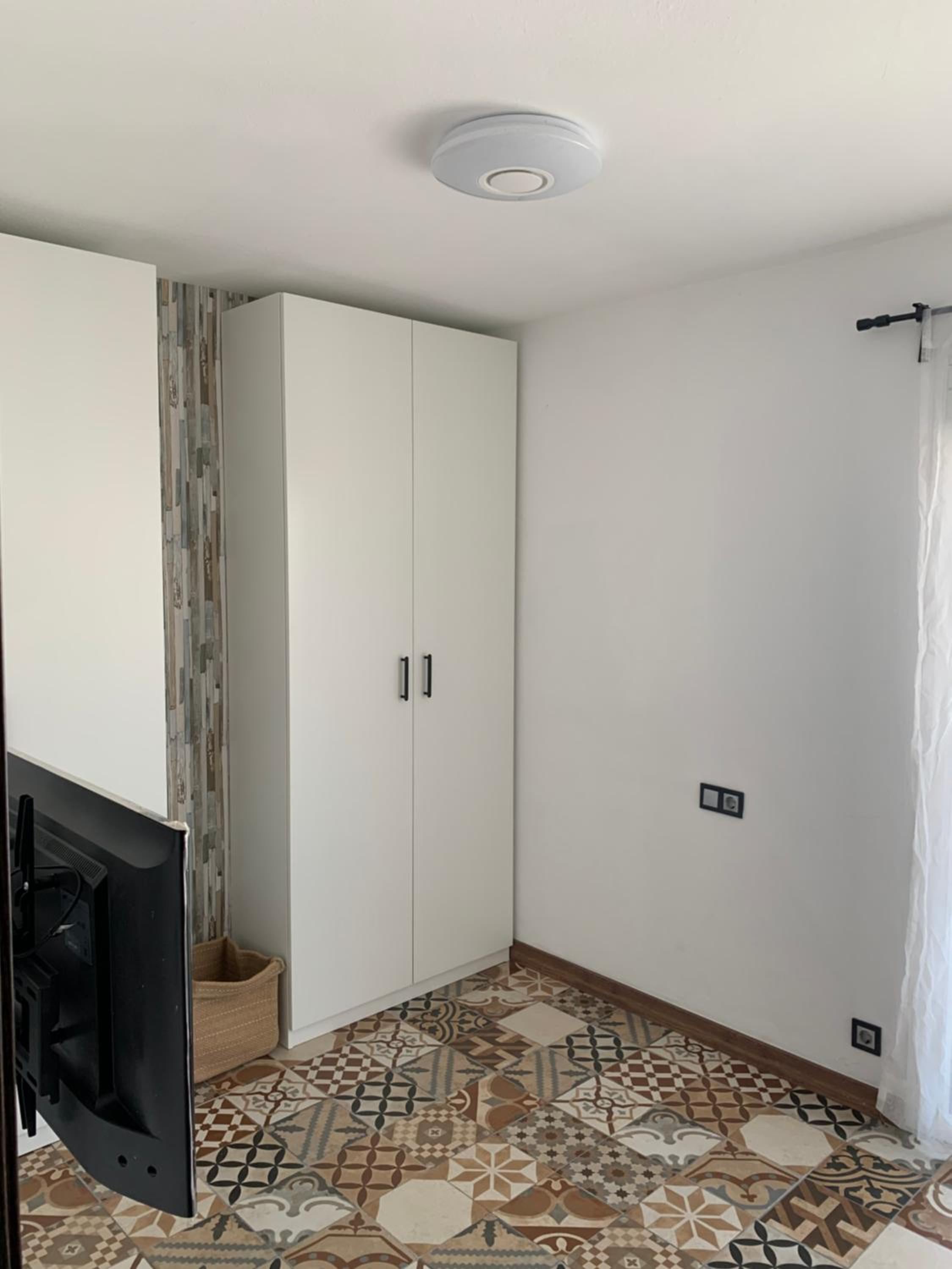 Three-Bedroom House - Photo 25