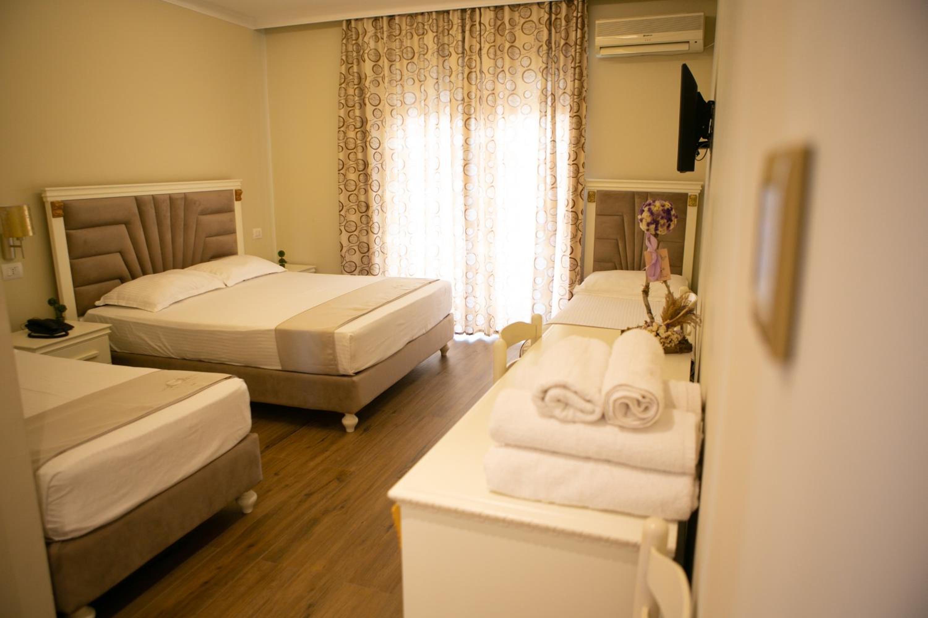 Deluxe Quadruple Room with Balcony