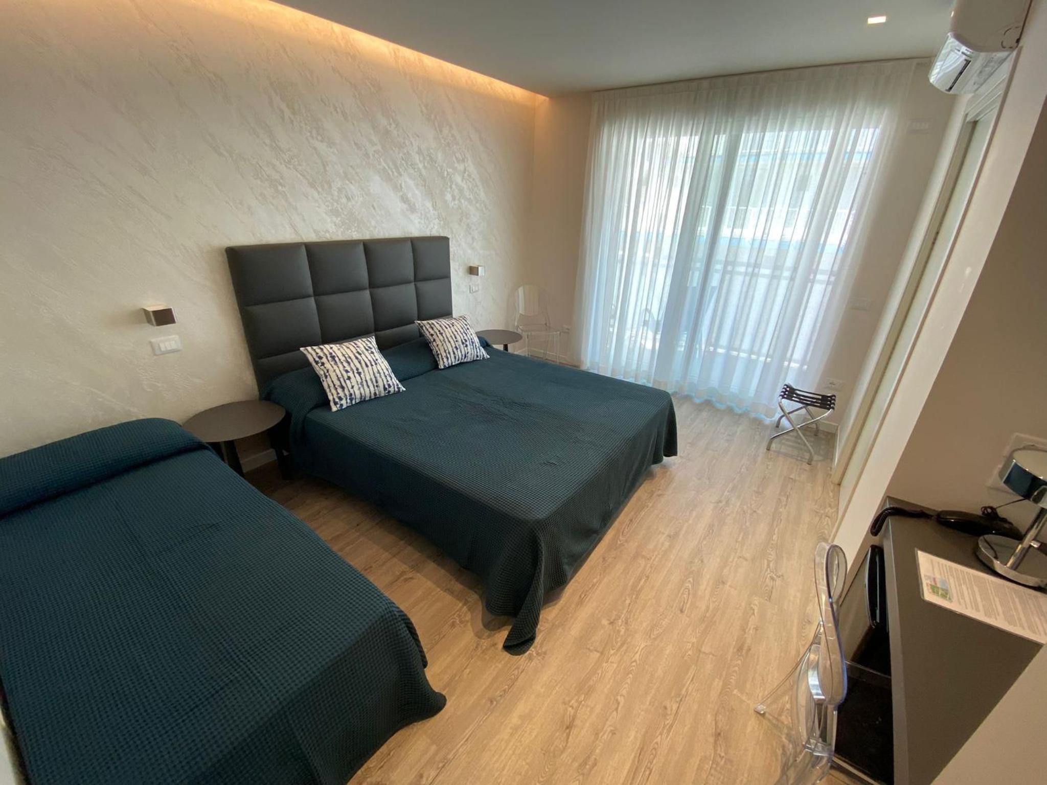 Deluxe Triple Room with Side Sea View photo 1