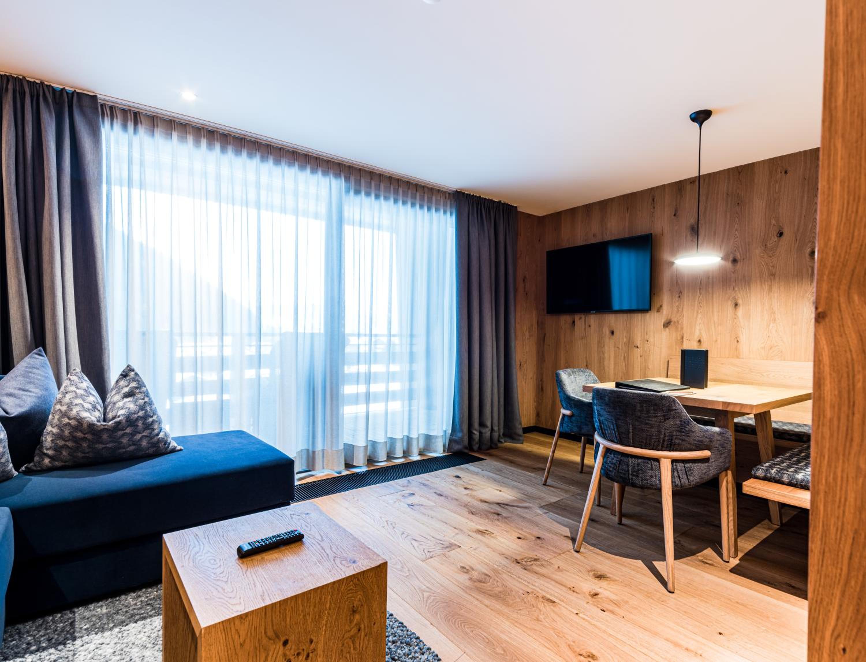 living room with a couch, table, and television