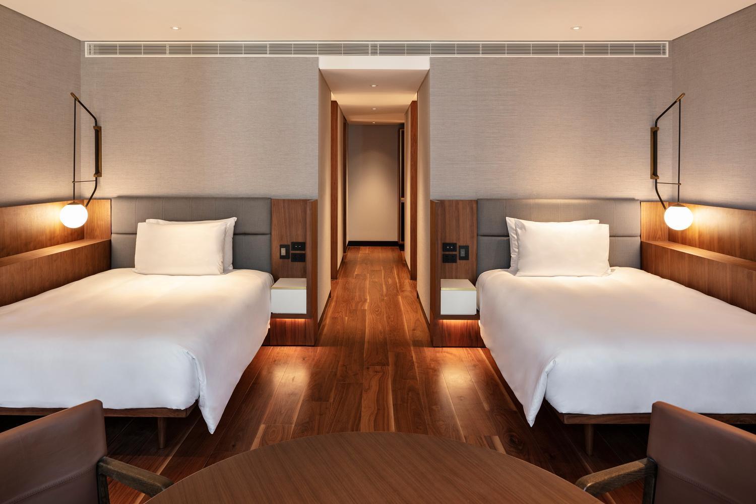 hotel room with two twin beds and a coffee table