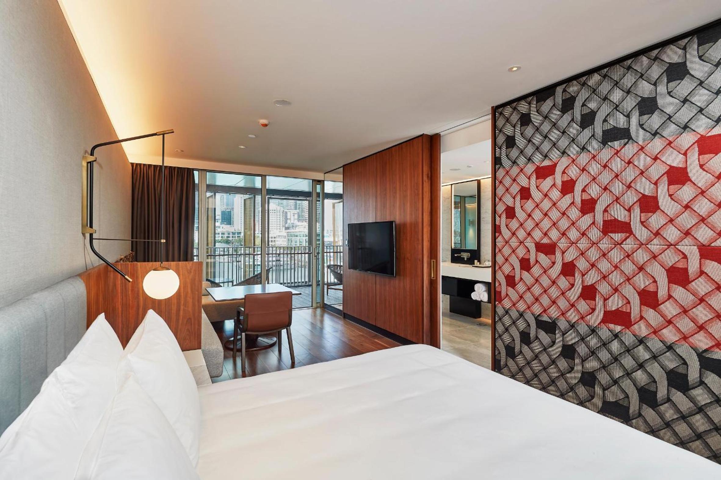 hotel room with a view of the city in the background
