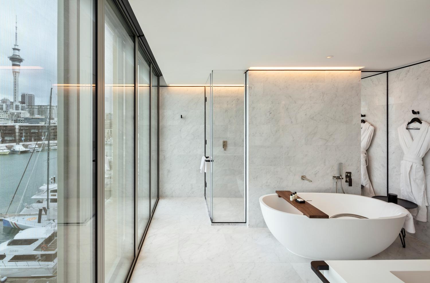 bathroom with a bathtub and a view of the city
