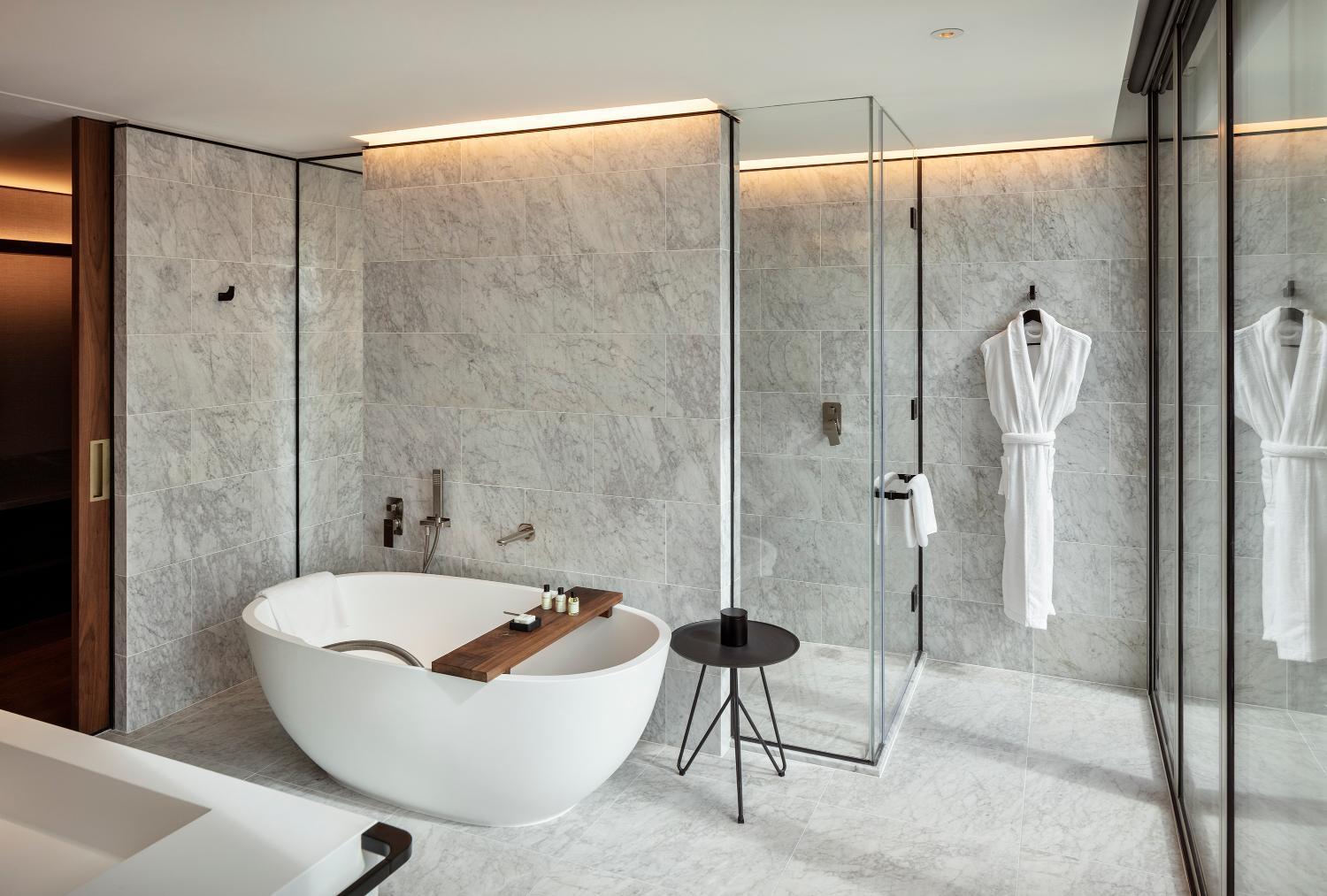 bathroom with a bathtub in the middle of it