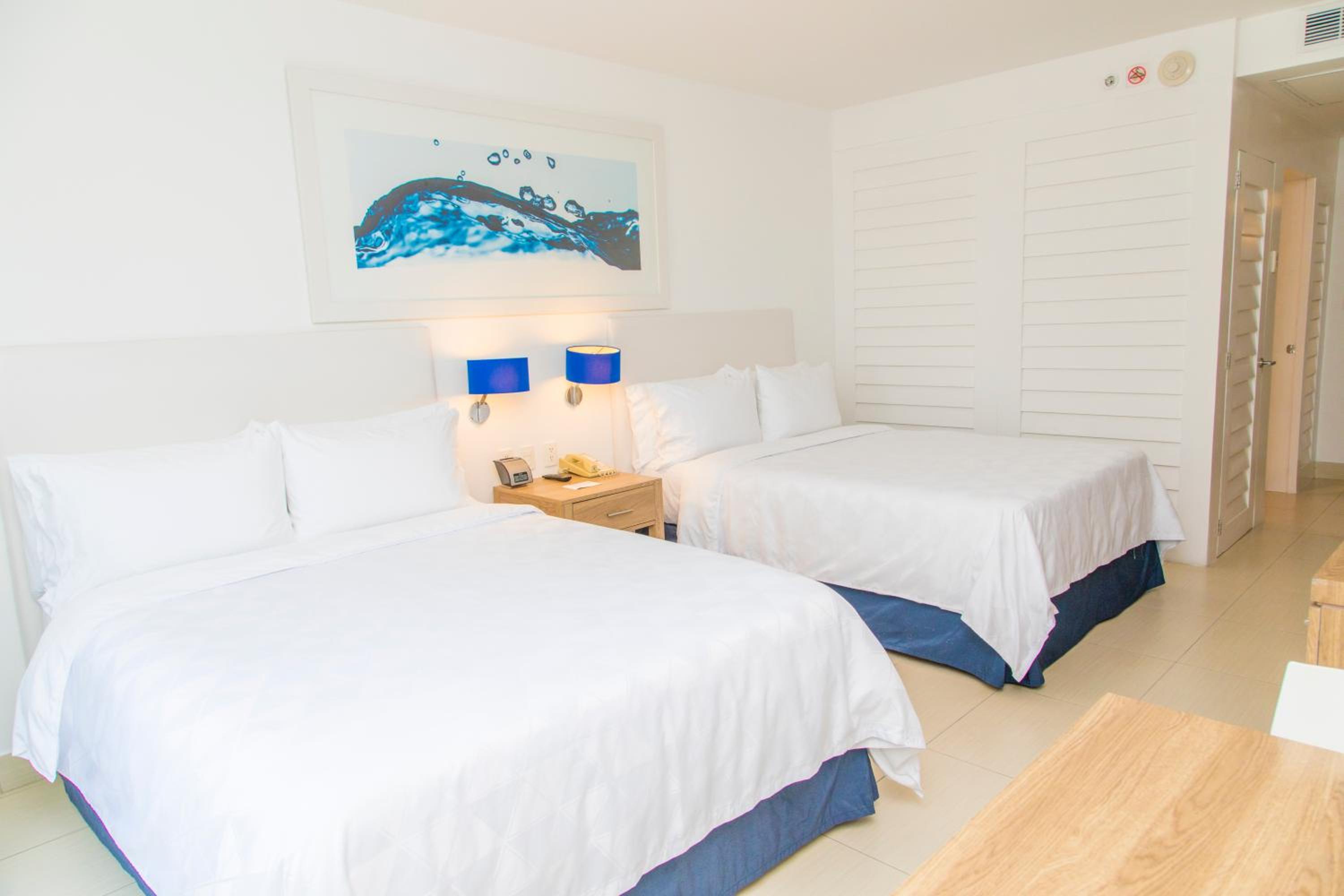 Standard Queen Room with Two Queen Beds and Balcony - Photo 1