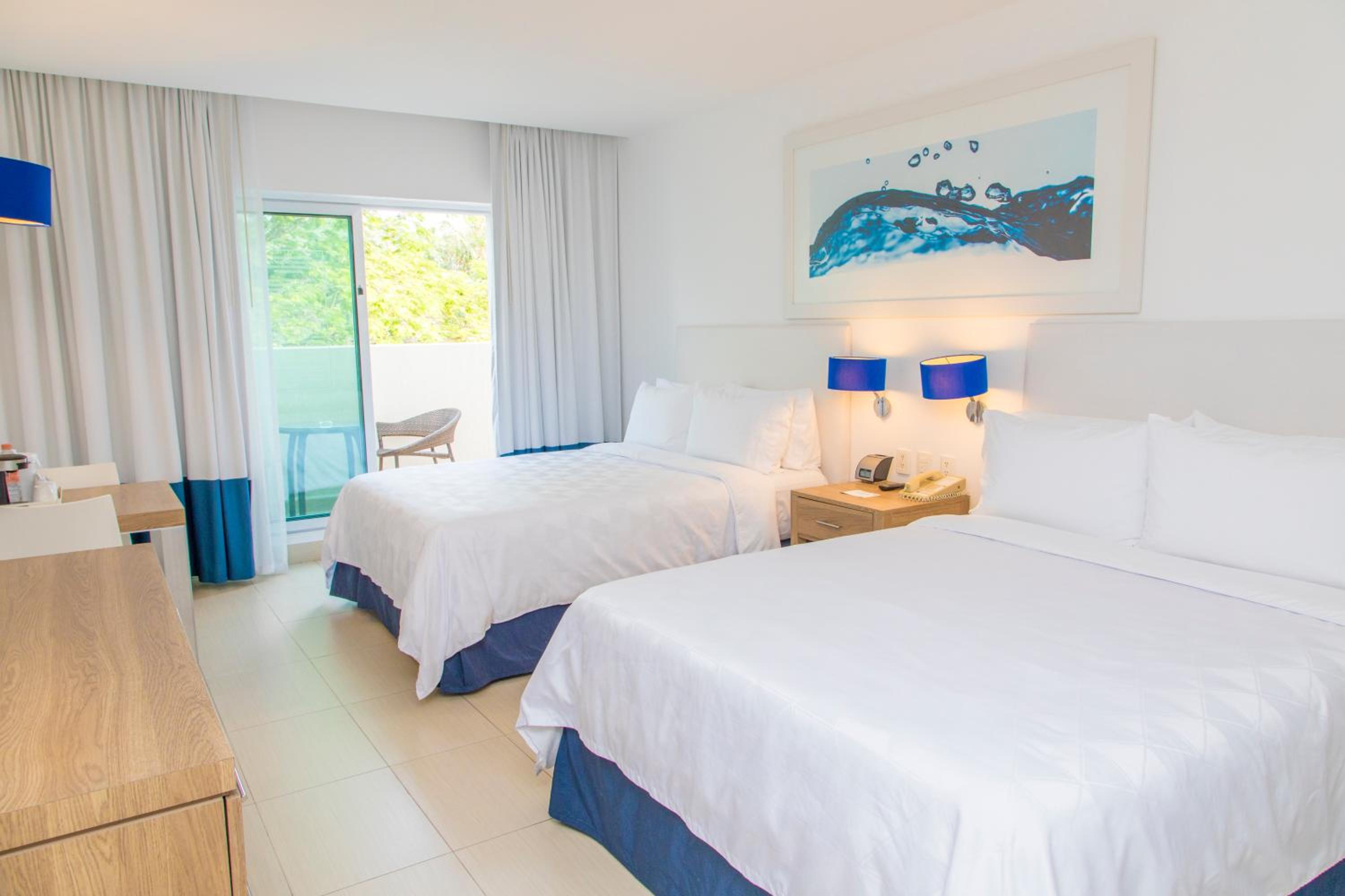 Standard Queen Room with Two Queen Beds and Balcony - Photo 2