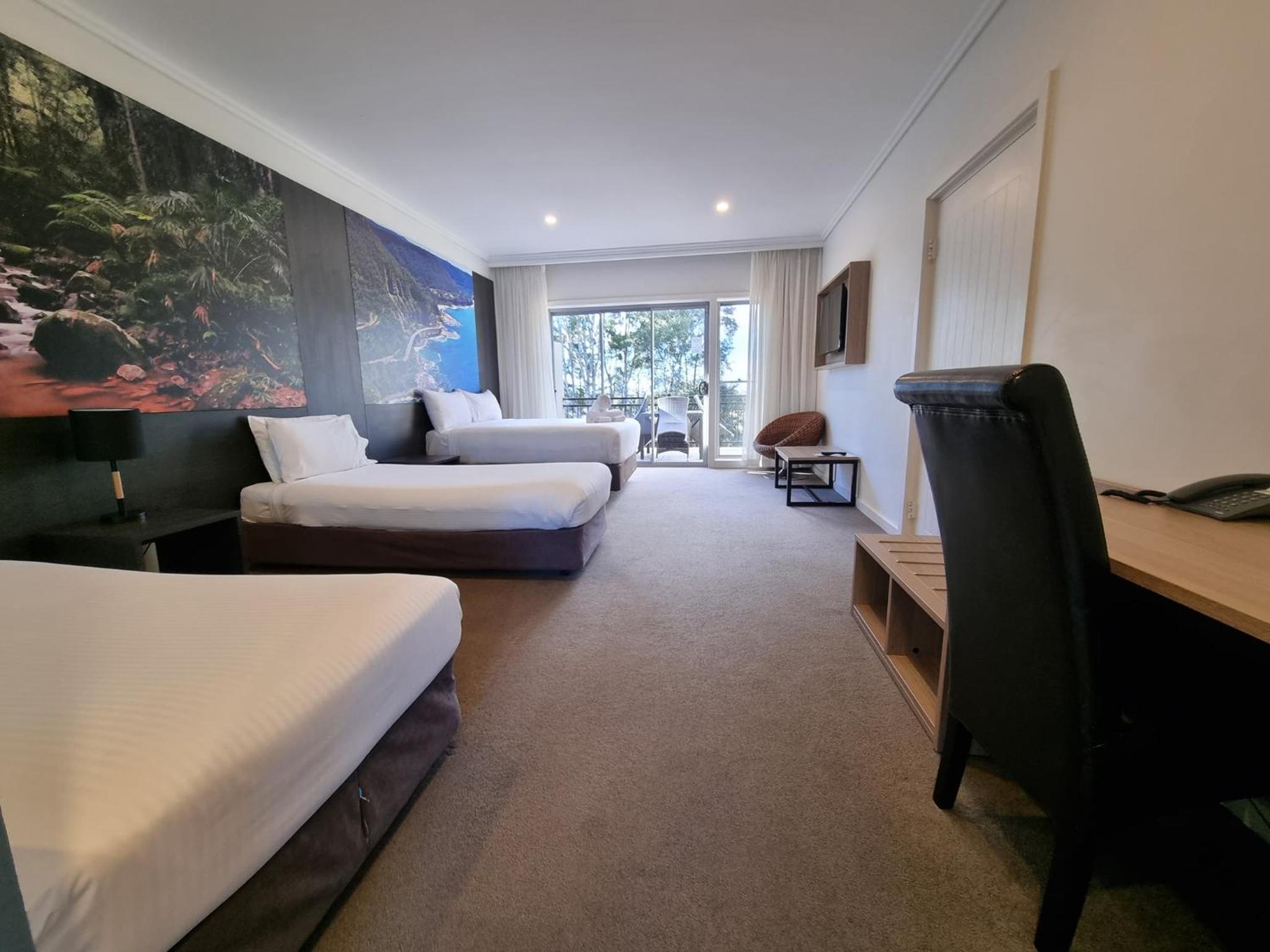 Superior Room with One King Bed and One Double Bed and Balcony - Photo 1