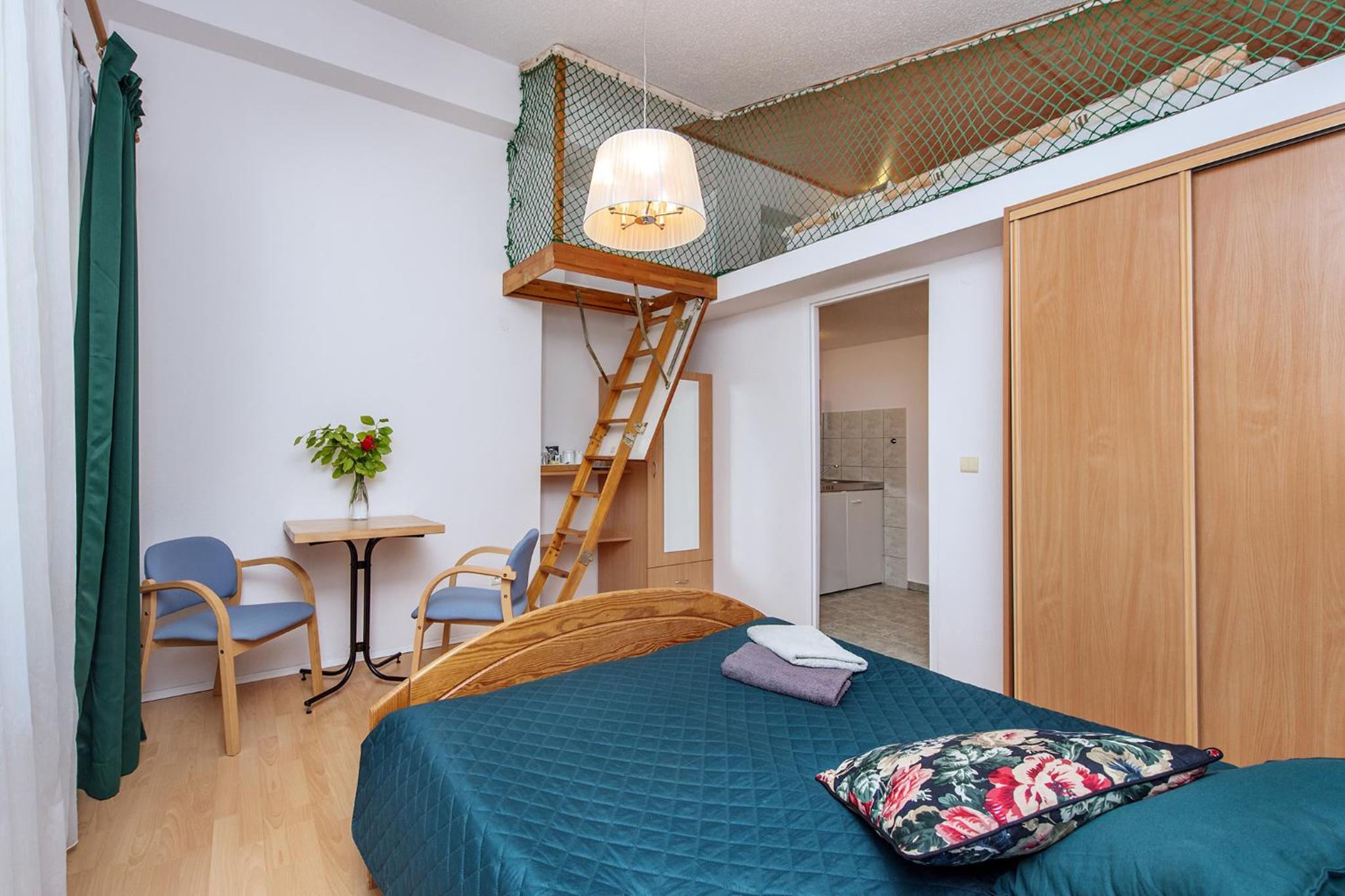 Family Room with Balcony and Mezzanine photo 1