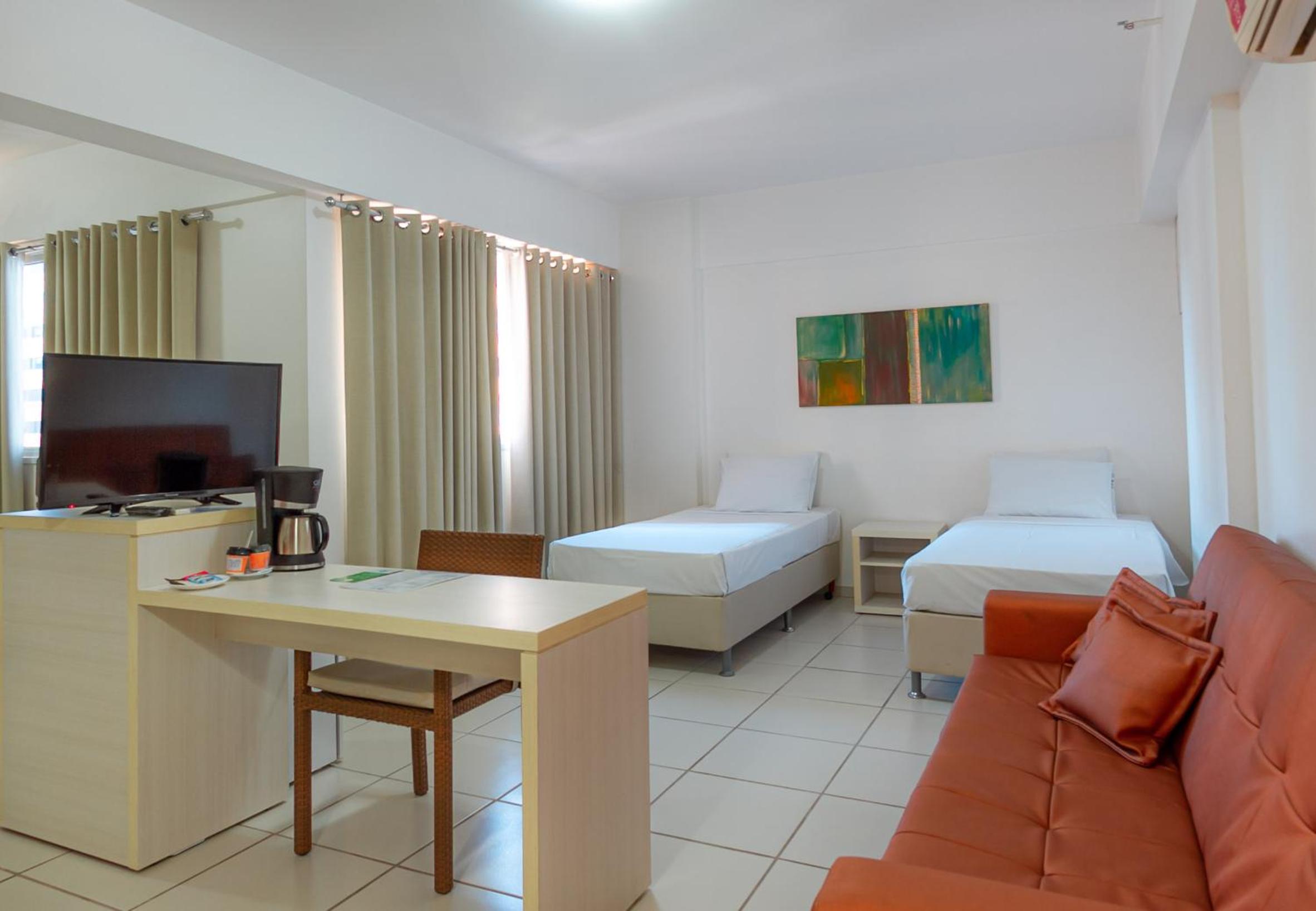 Deluxe Queen Suite with Sofa Bed photo 1