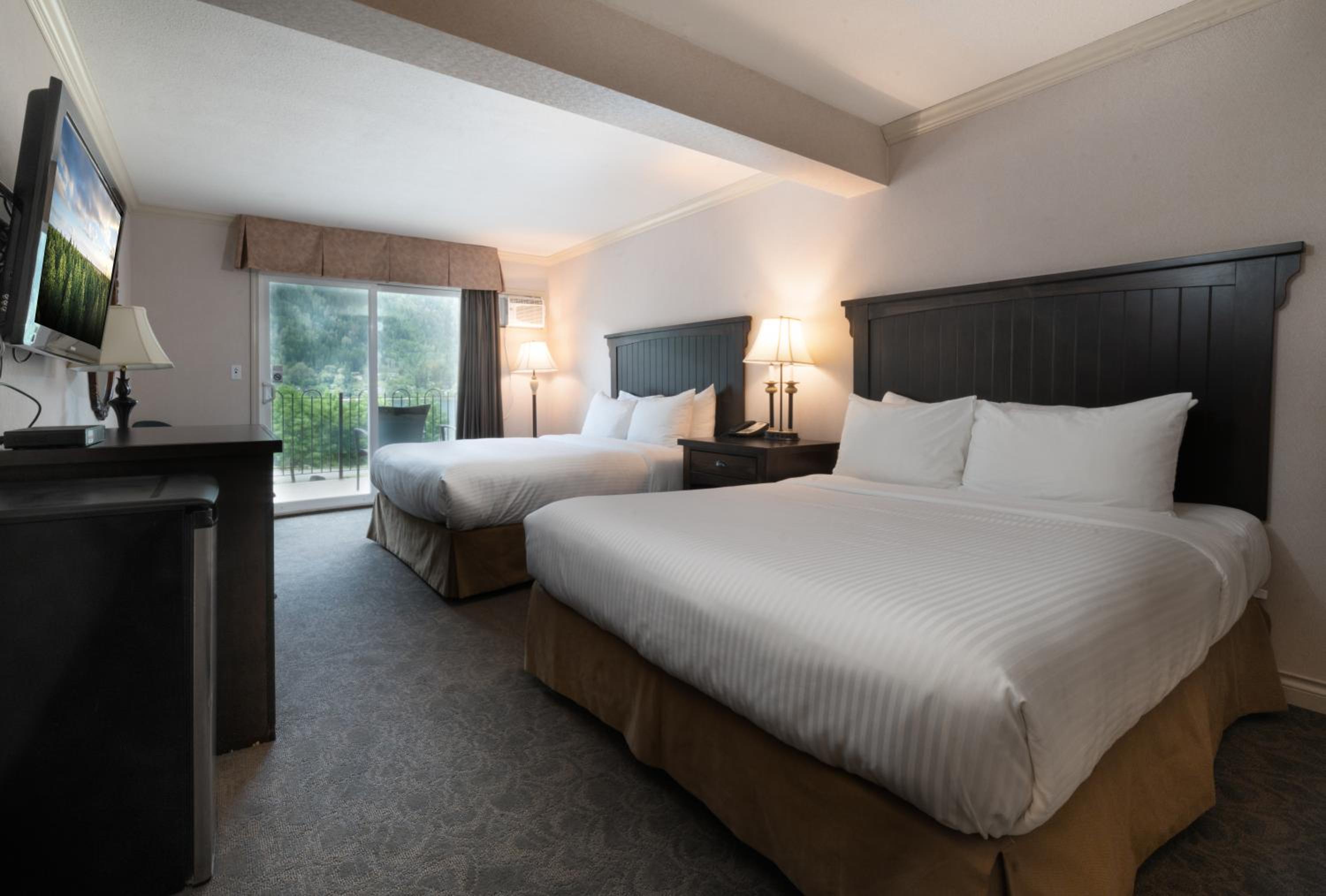Deluxe Queen Room with Two Queen Beds - Photo 1