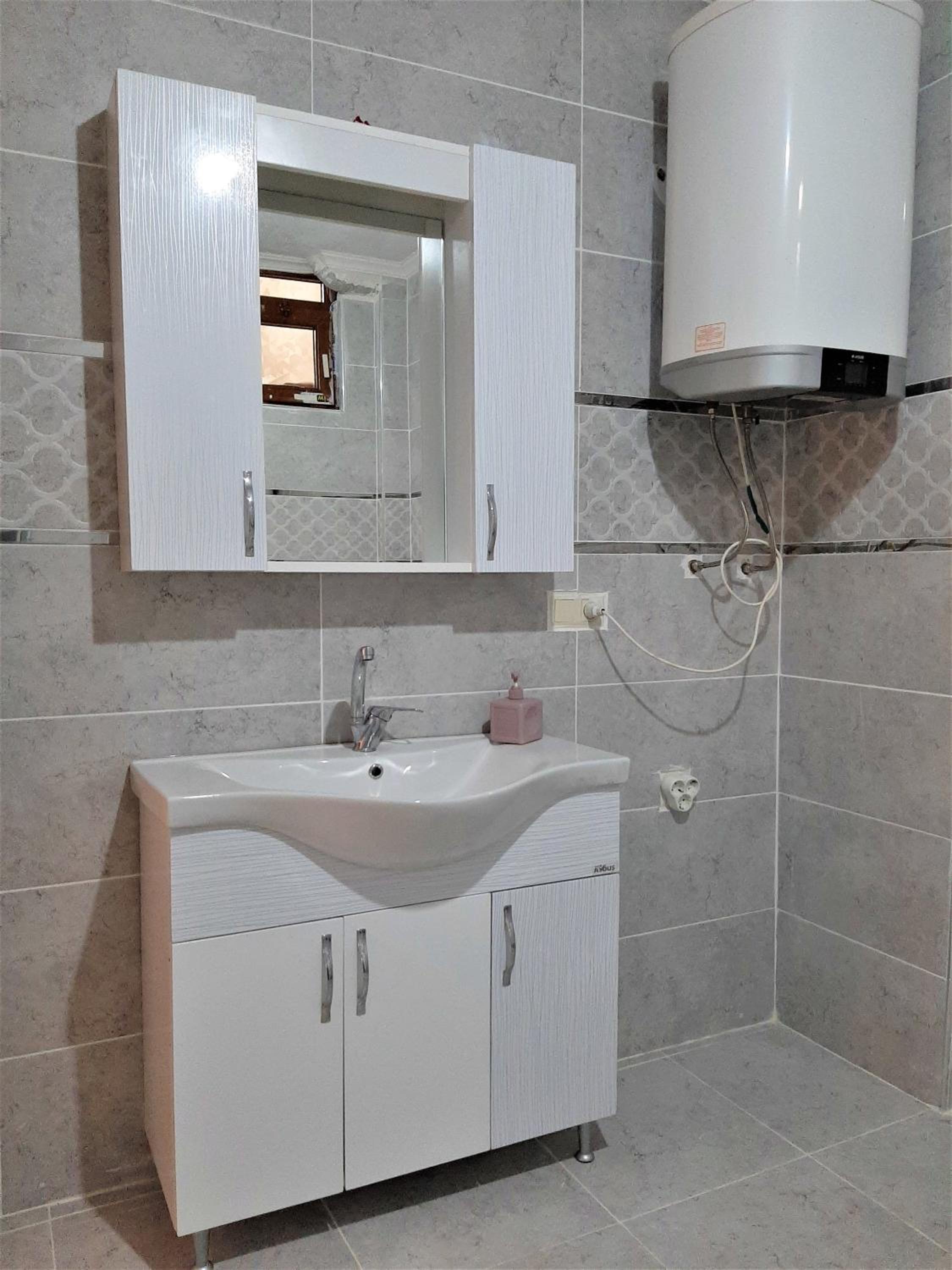 Three-Bedroom Apartment - Photo 28