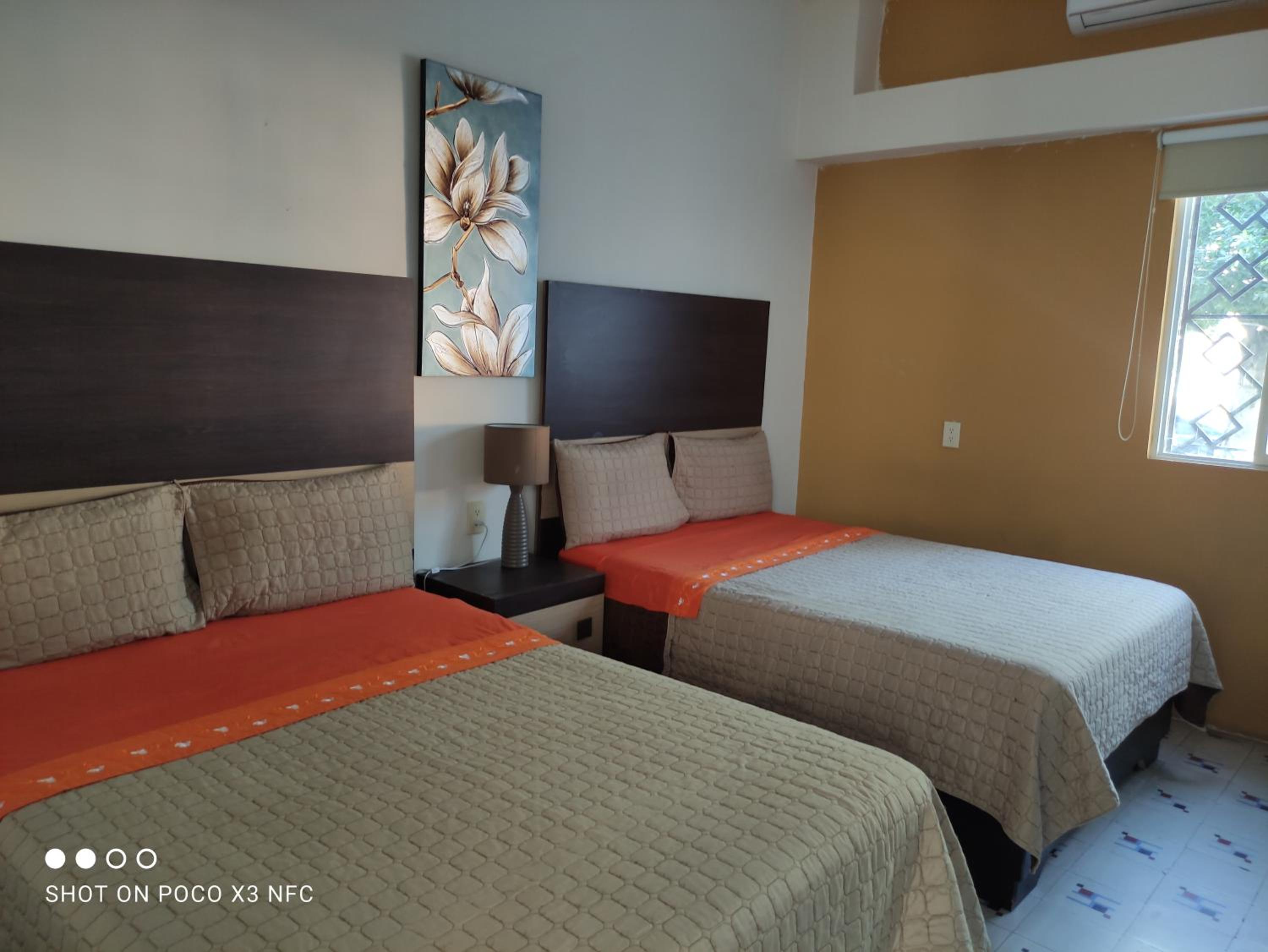 Standard Queen Room with Two Queen Beds photo 1
