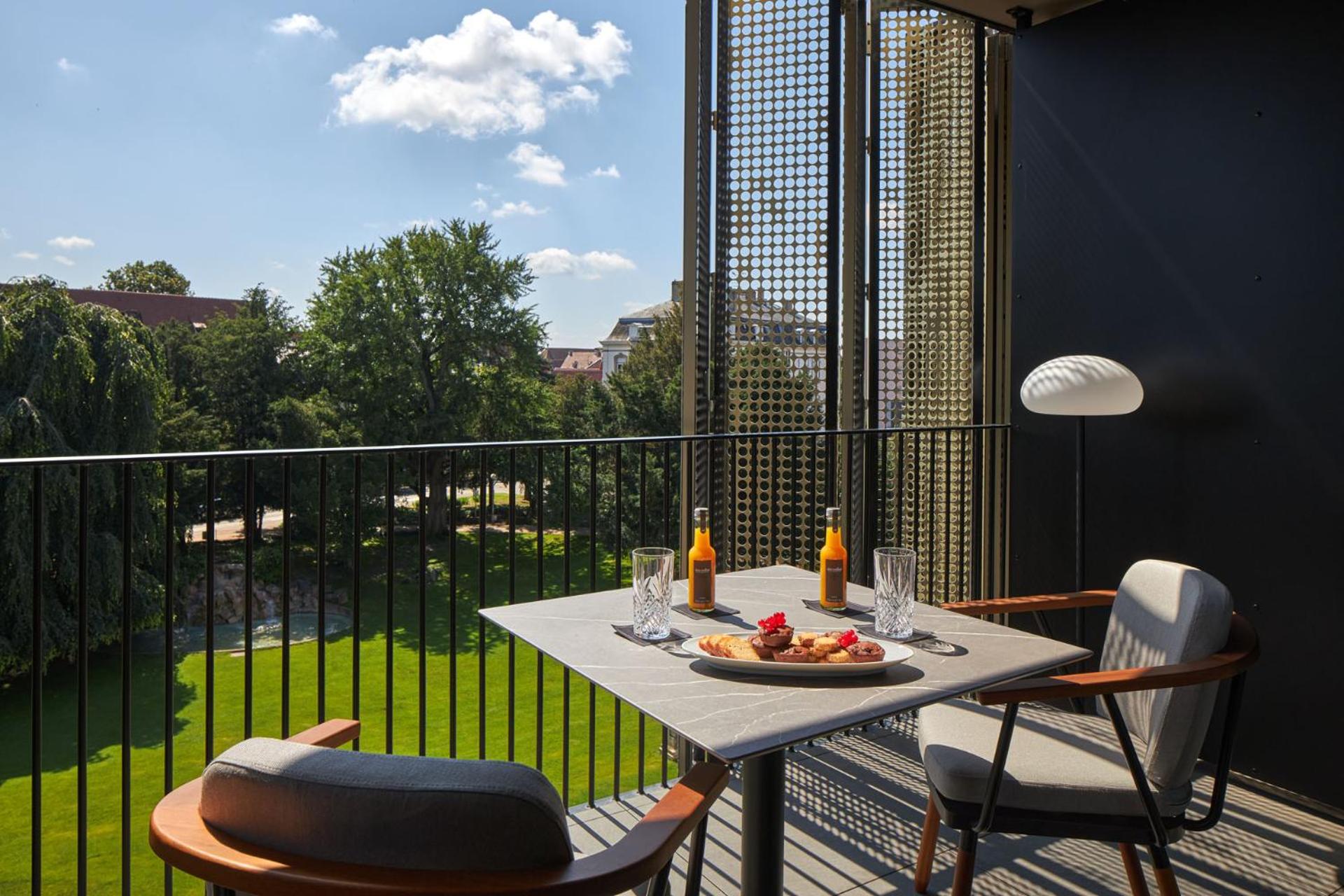 Deluxe King Room with Balcony - Photo 2