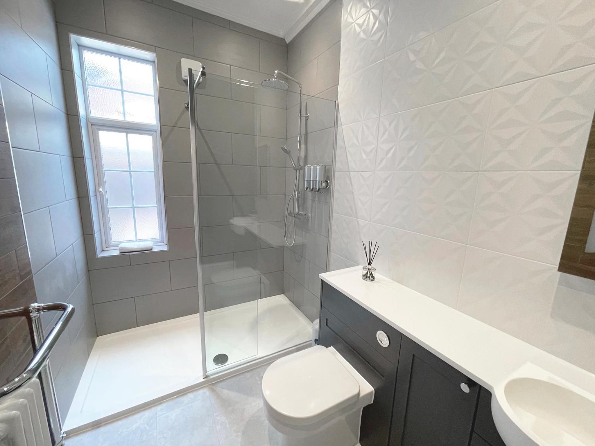 Three-Bedroom Apartment - Photo 3