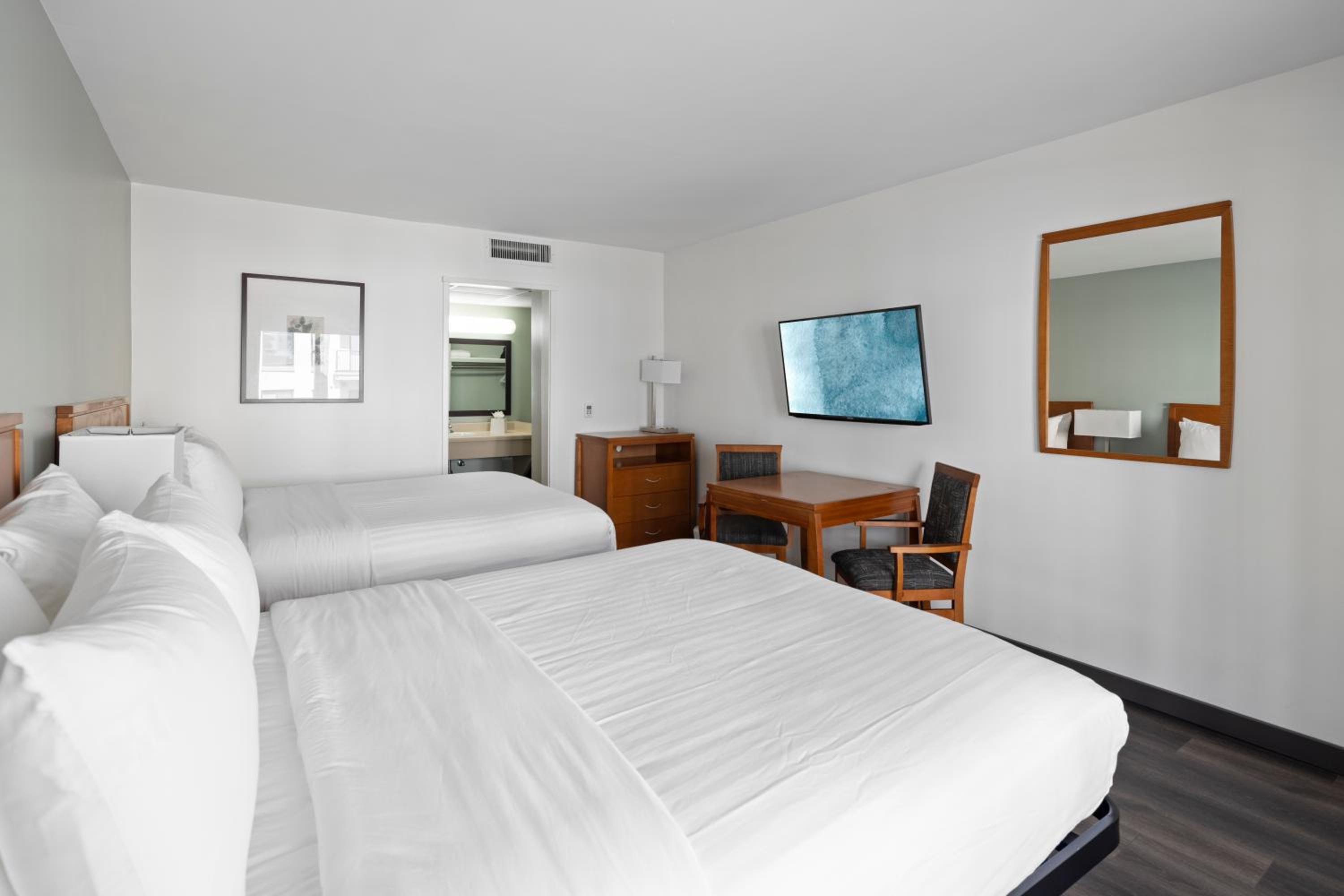 Queen Room with Two Queen Beds - Photo 1