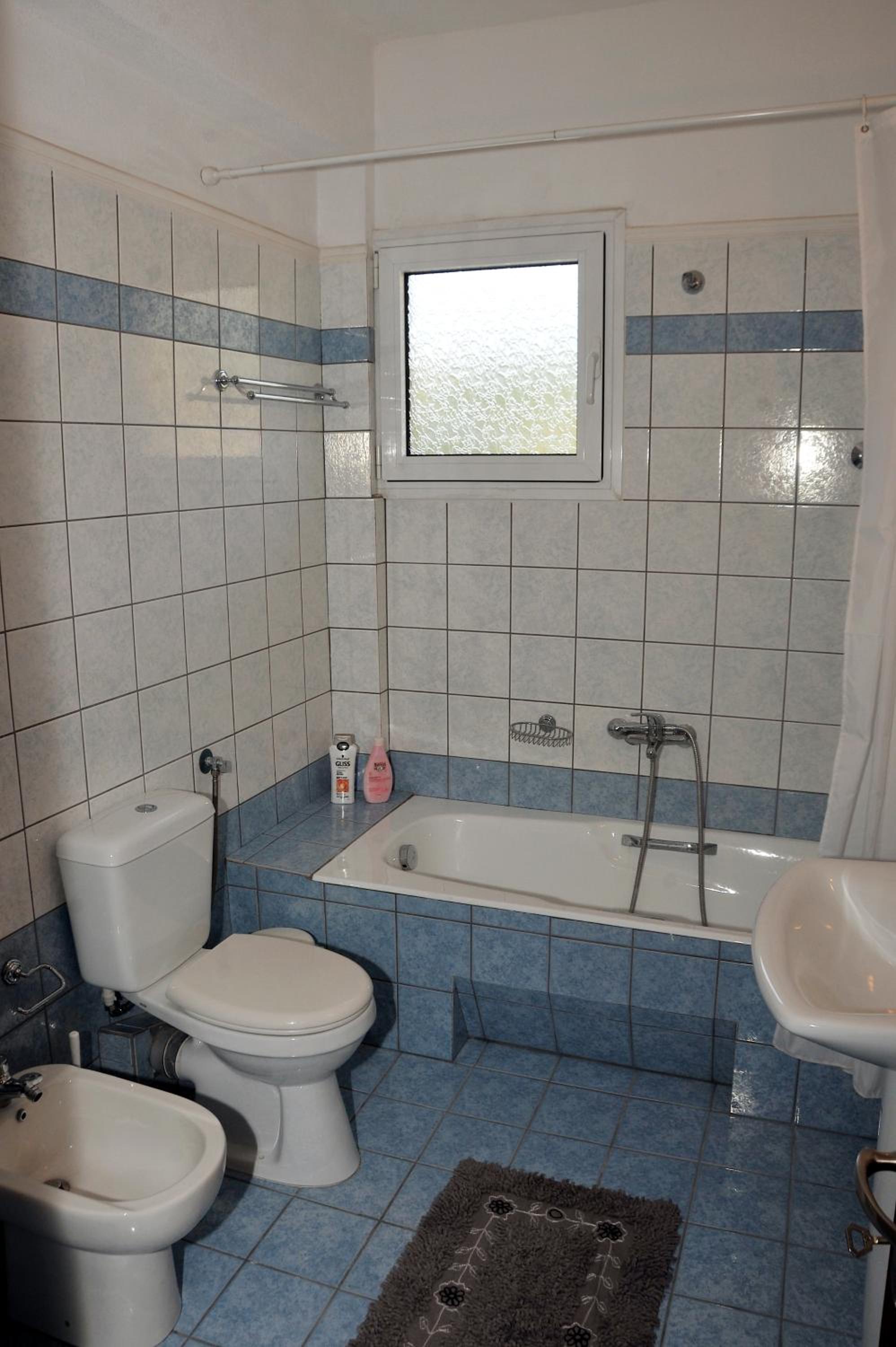 Three-Bedroom Apartment - Photo 12