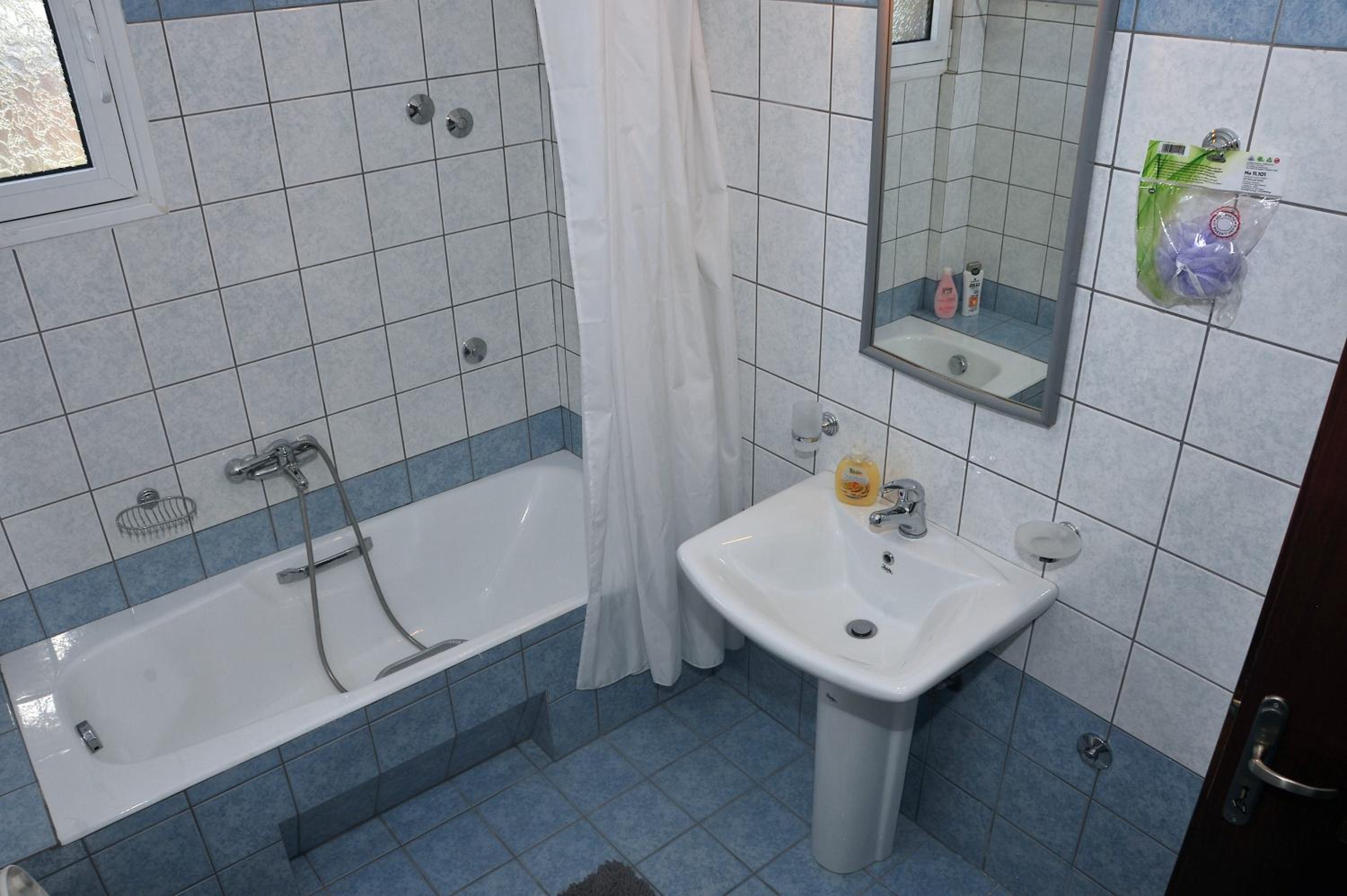 Three-Bedroom Apartment - Photo 11