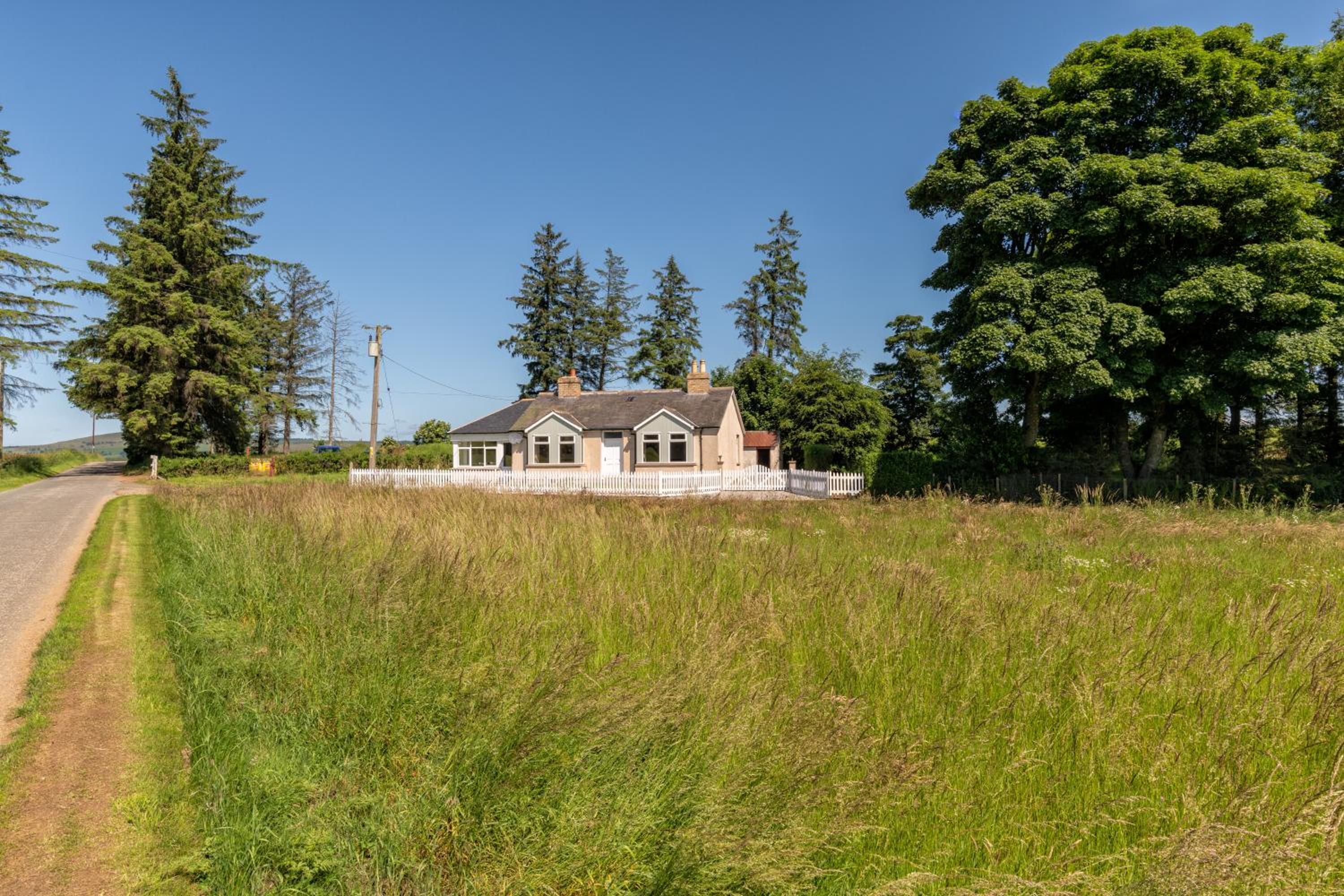 Three-Bedroom House - Photo 32