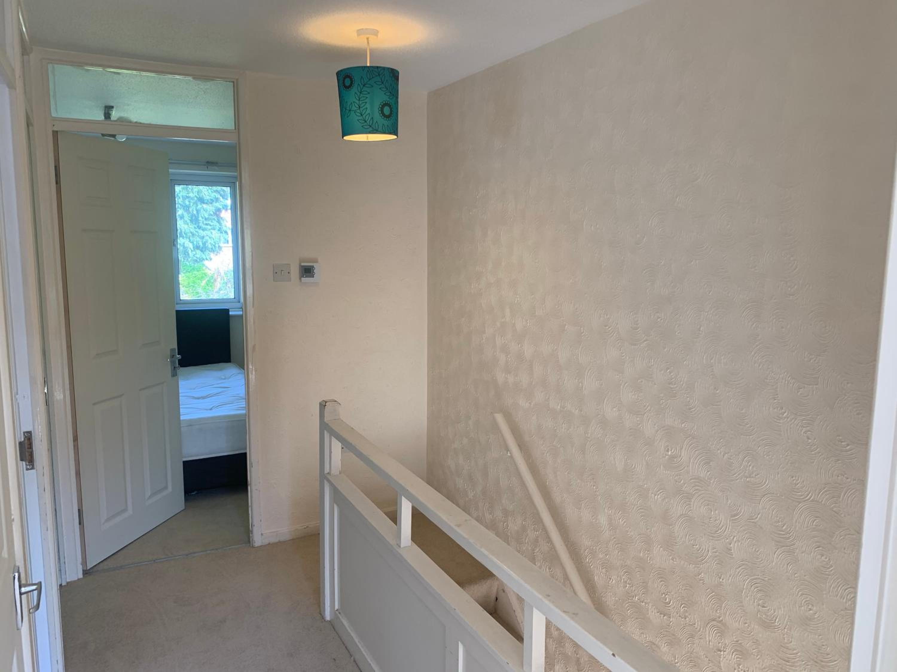 Three-Bedroom House - Photo 4