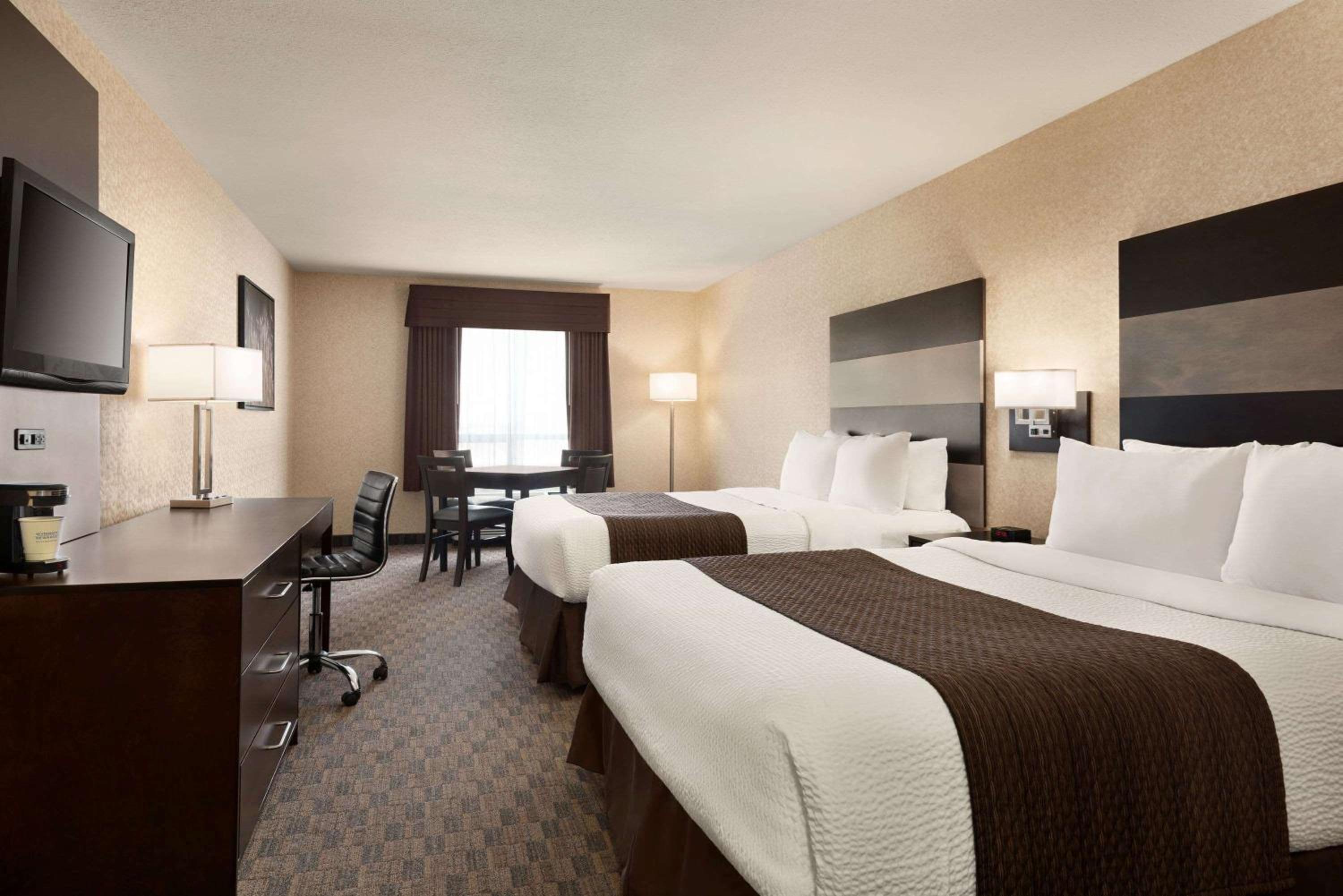 Deluxe Room with Two Queen Beds and One Sofa Bed - Non-Smoking - Photo 1