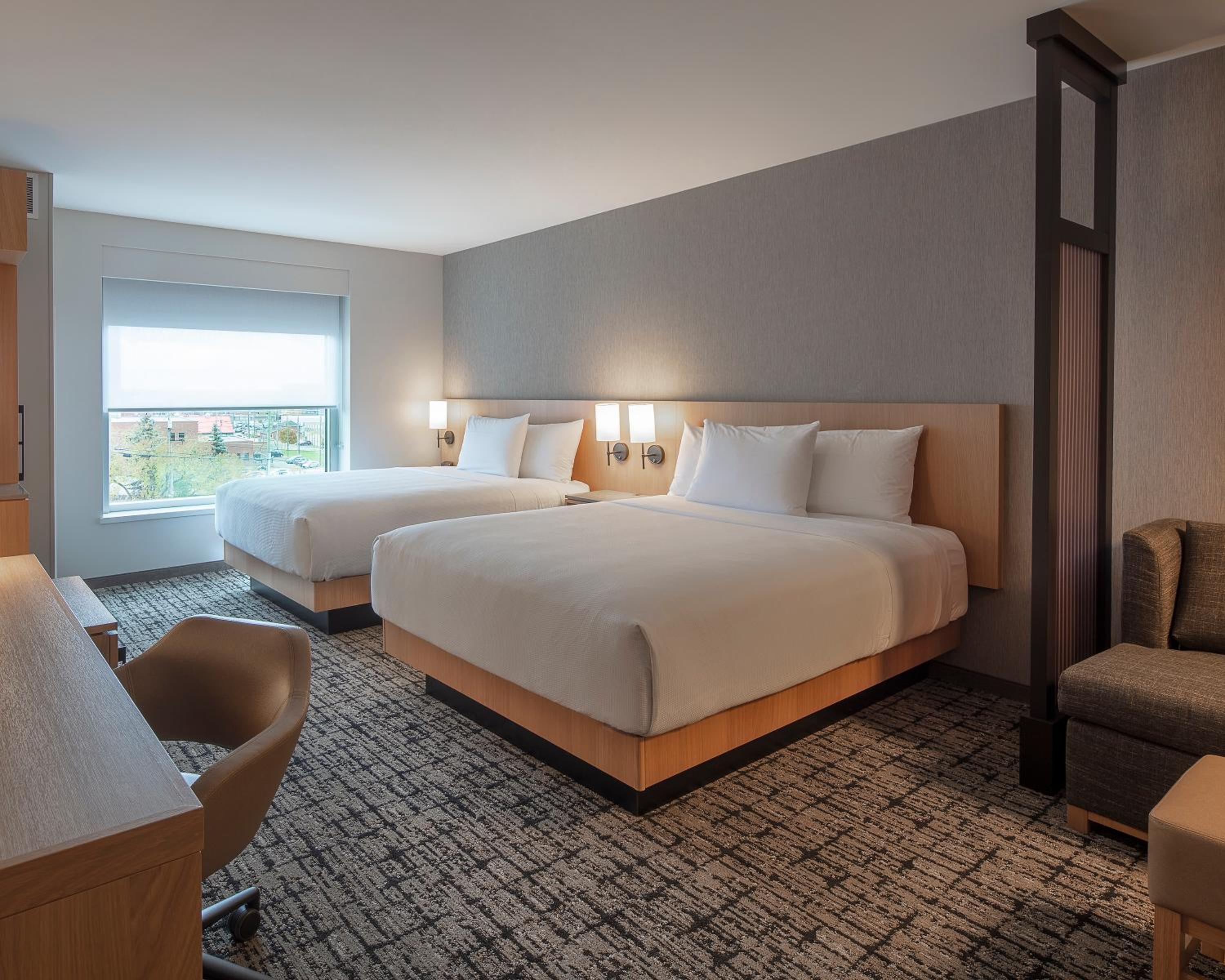 Standard Queen Room with Two Queen Beds and Sofa Bed - Photo 3