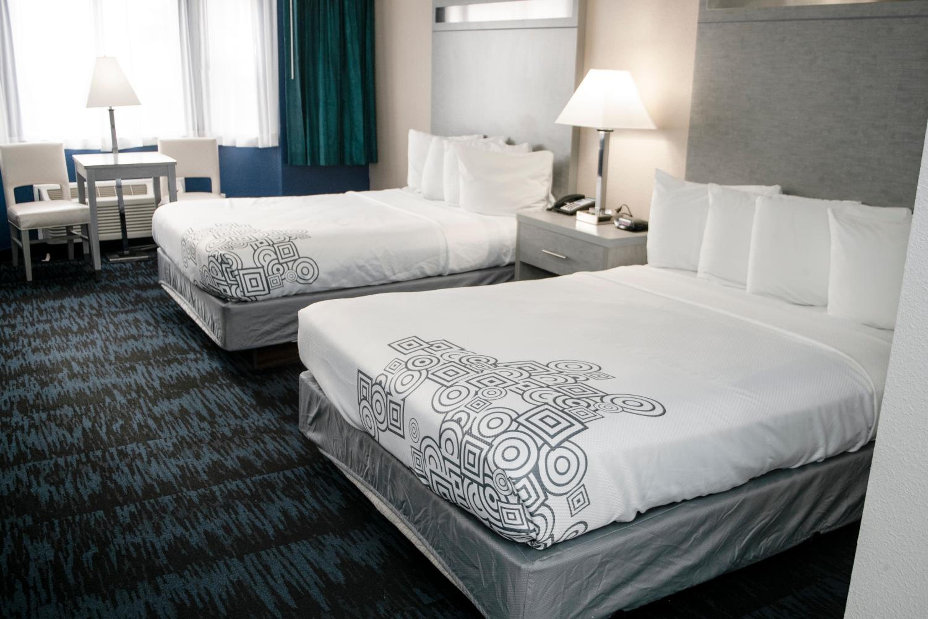 Queen Suite with Two Queen Beds & Sofa Bed photo 3