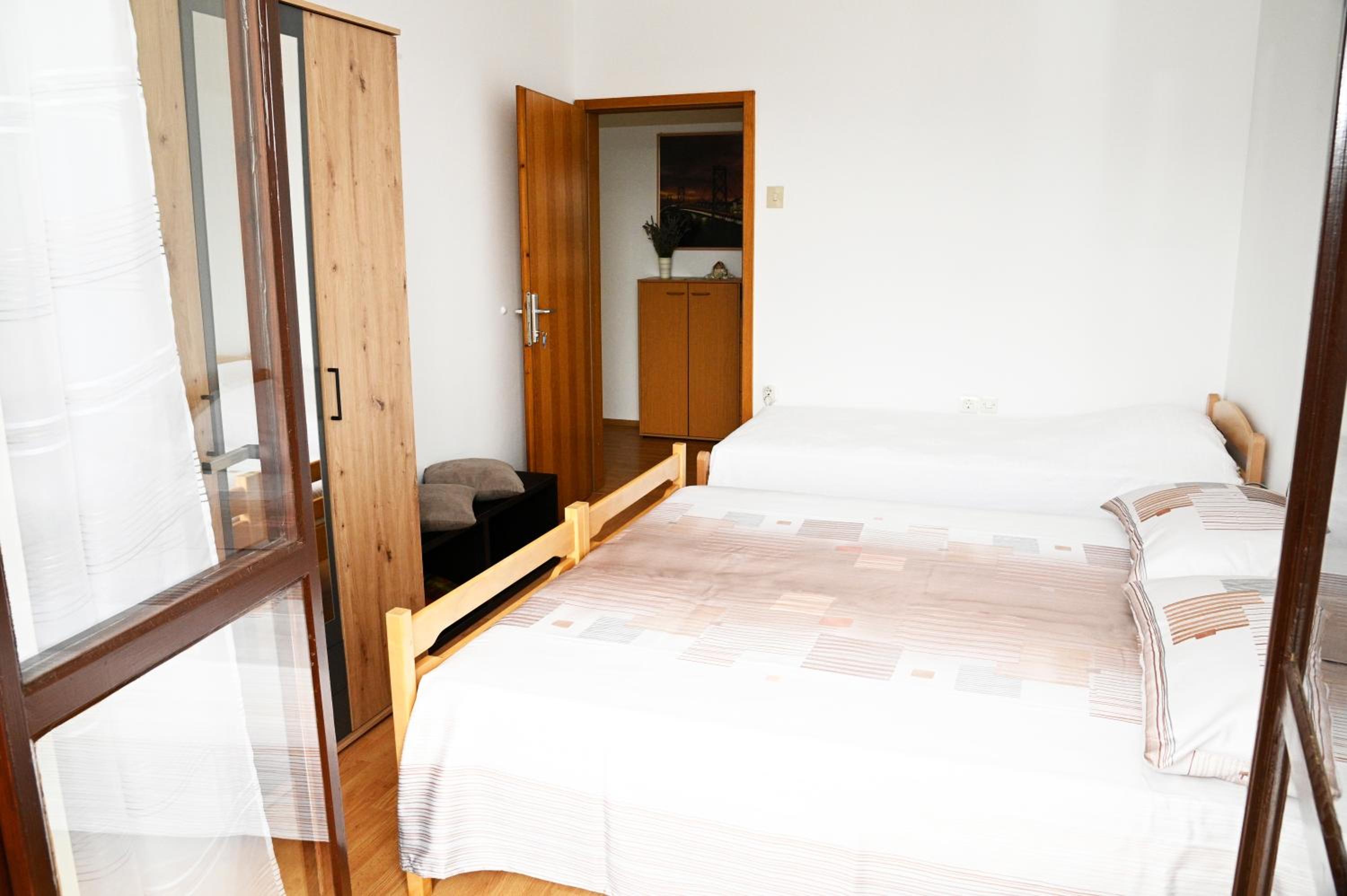 Three-Bedroom Apartment - Photo 12