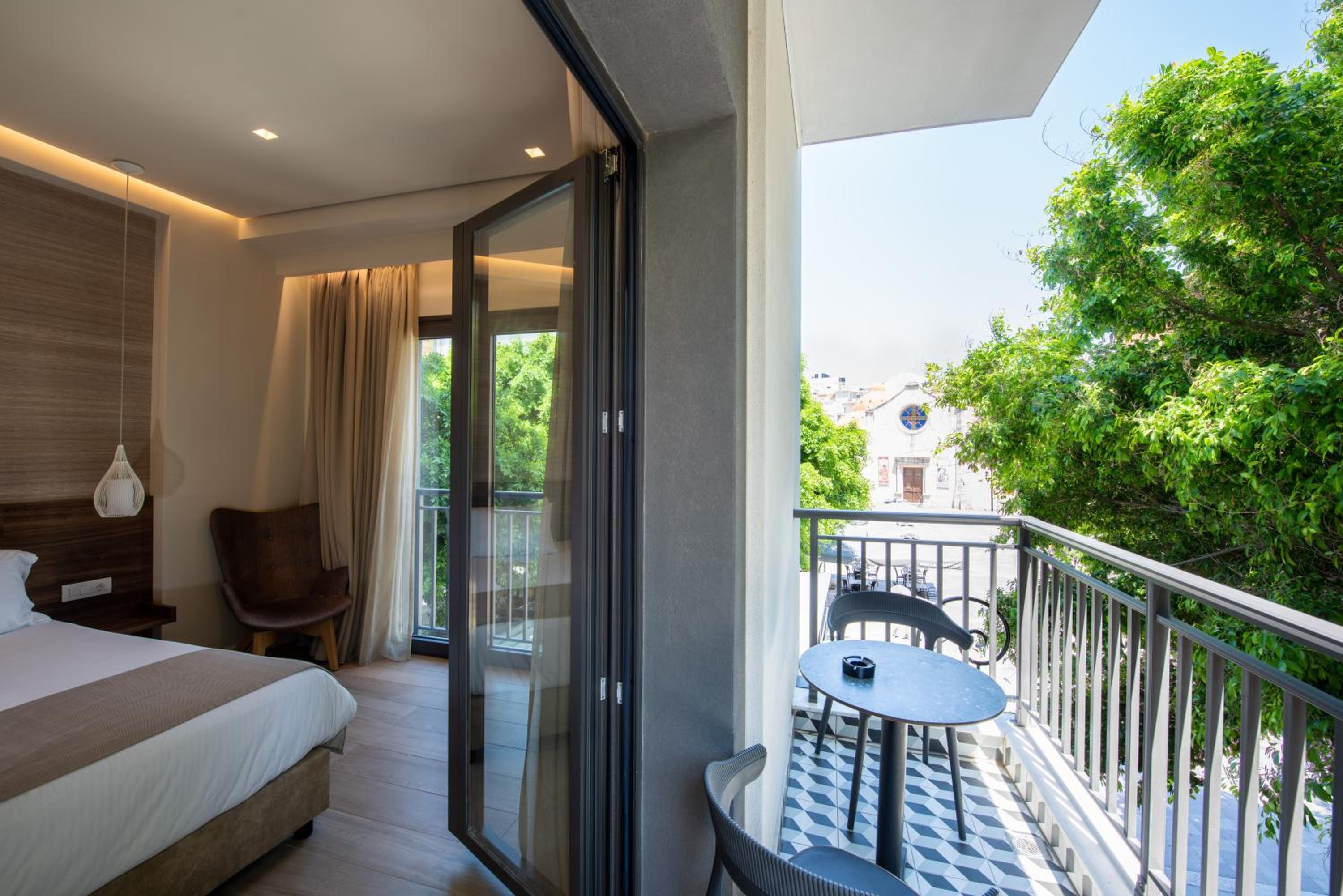 Deluxe Room with Balcony and City View - Photo 2