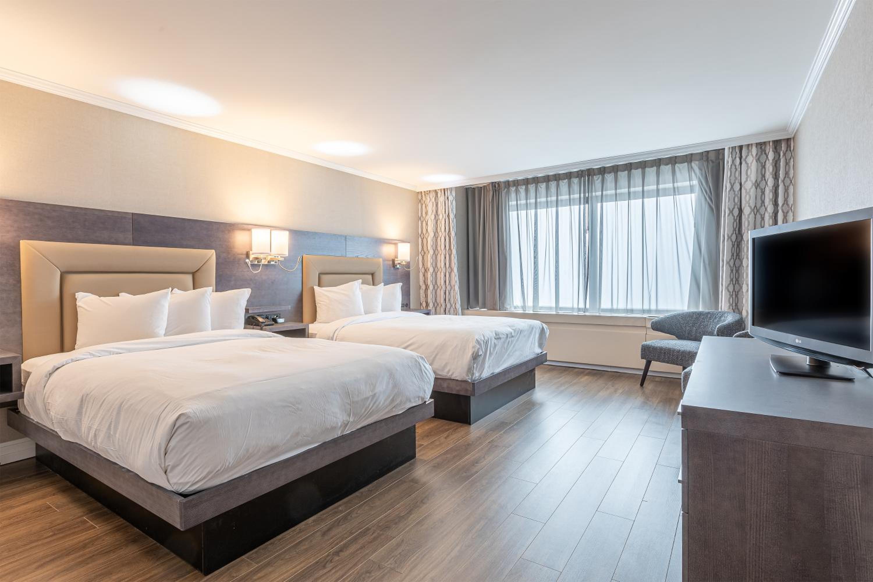 Queen Room with Two Queen Beds - Photo 1