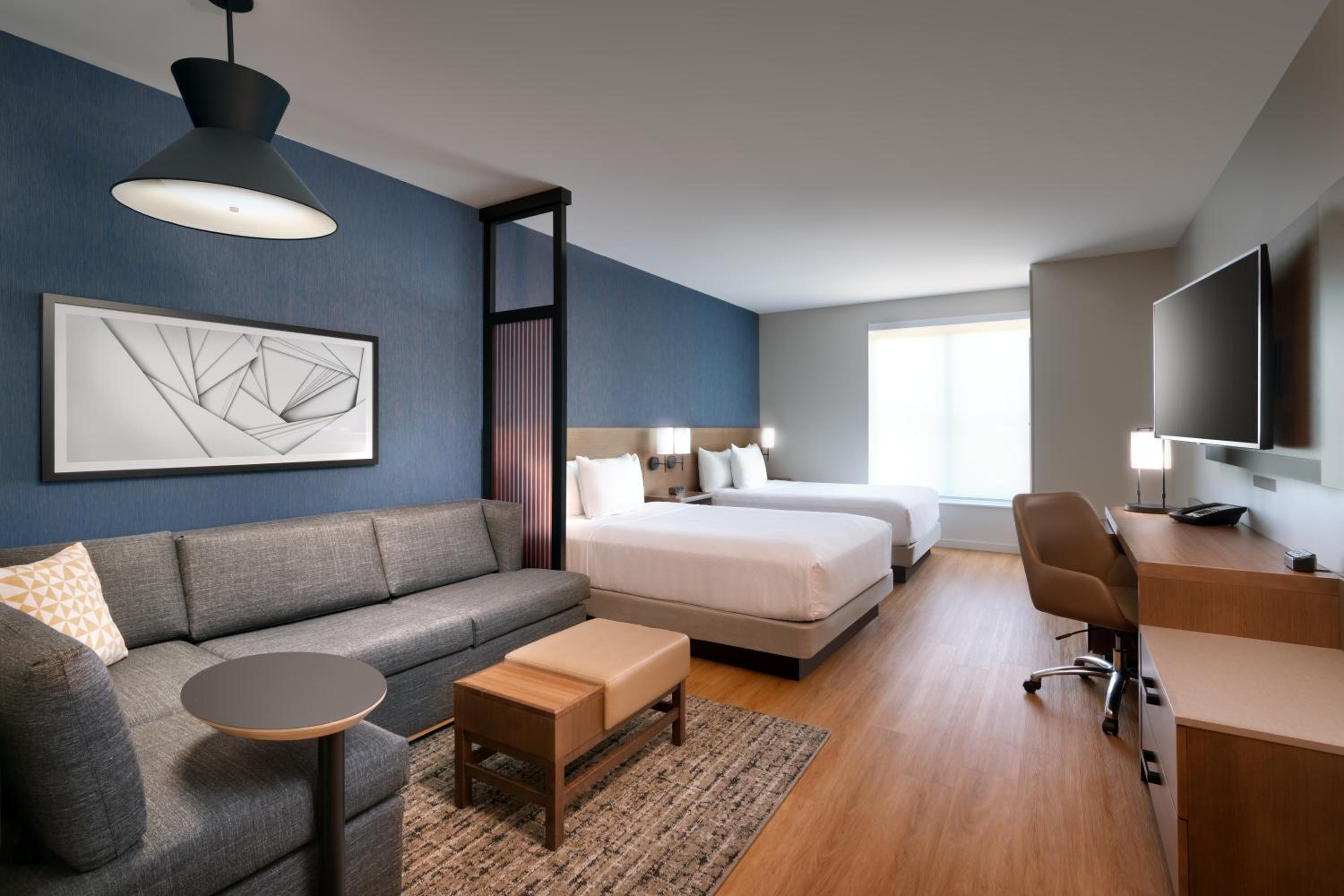Standard Queen Room with Two Queen Beds and Sofa Bed - Photo 1