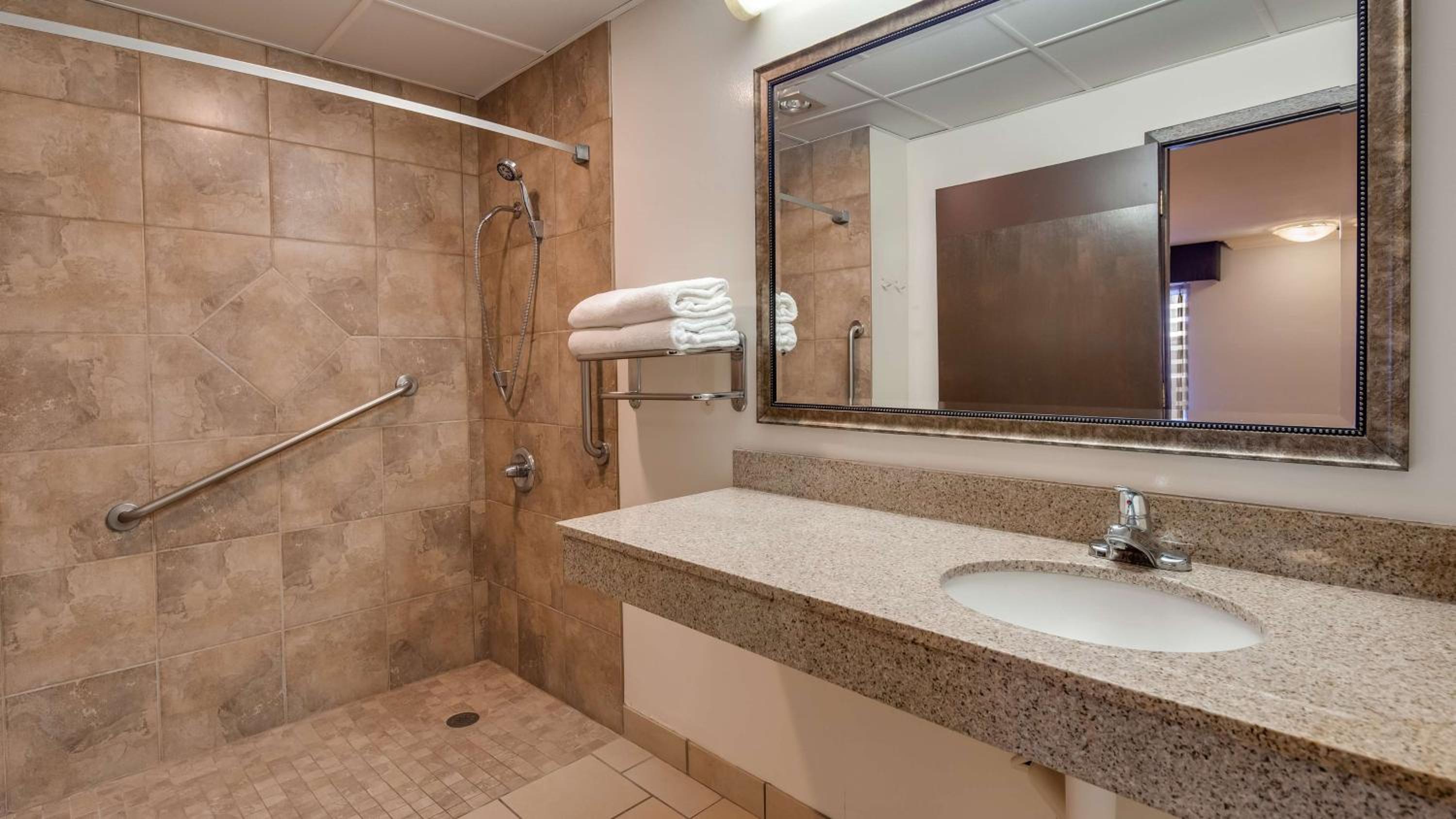 King Room with Mobility Accessible Roll-In Shower and Sofa Bed