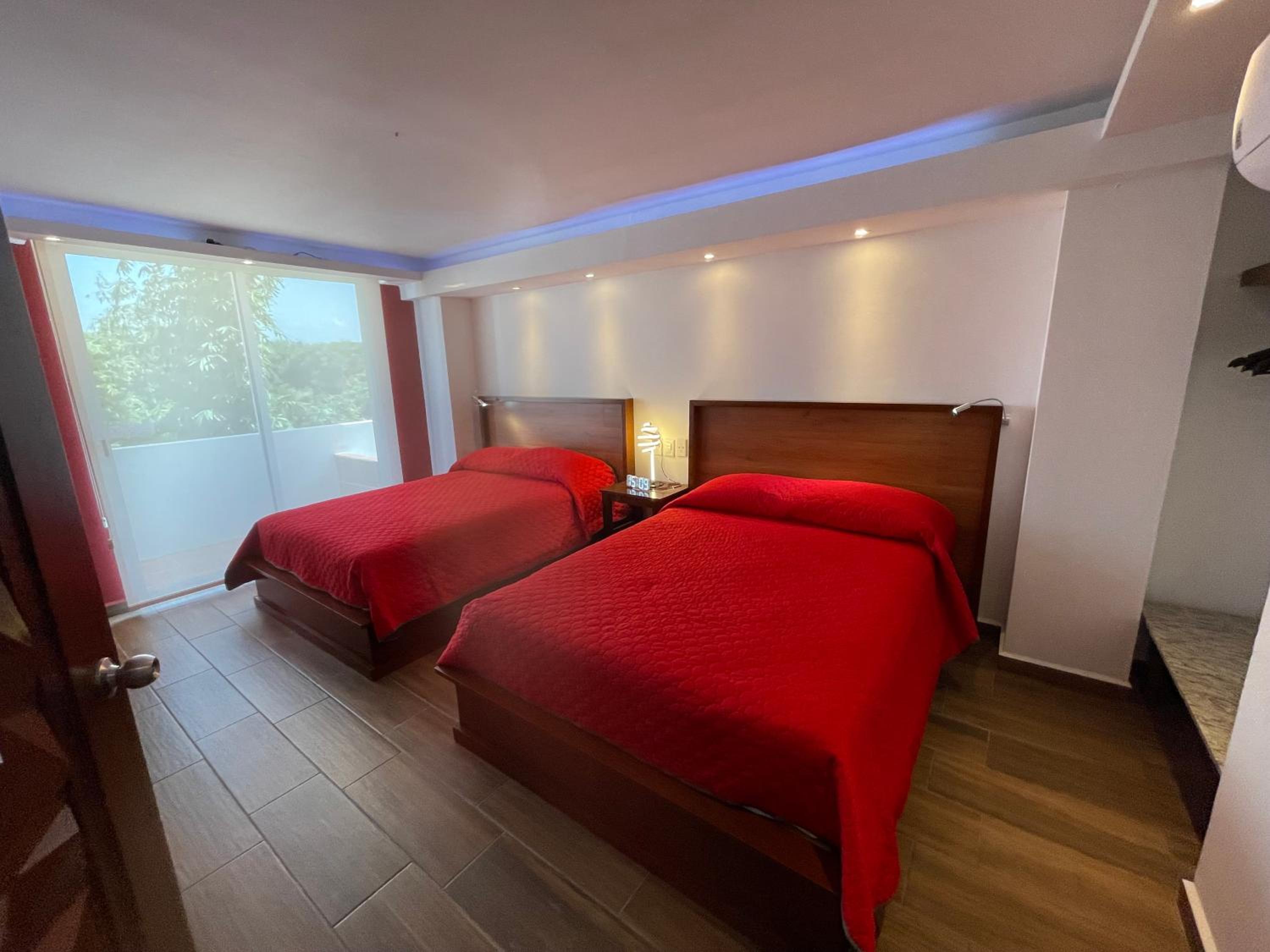 Deluxe Quadruple Room - Photo 16