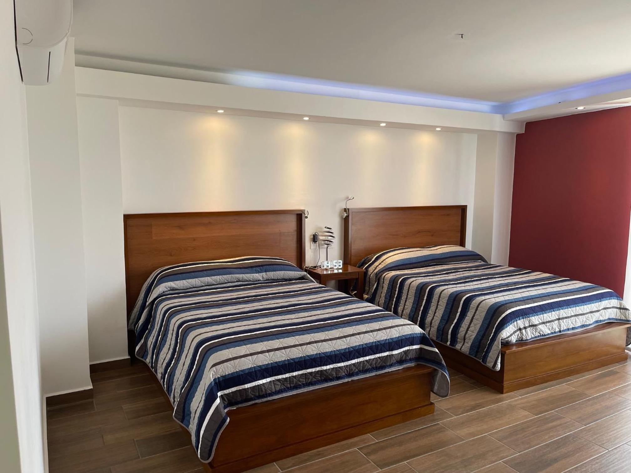 Deluxe Quadruple Room - Photo 15