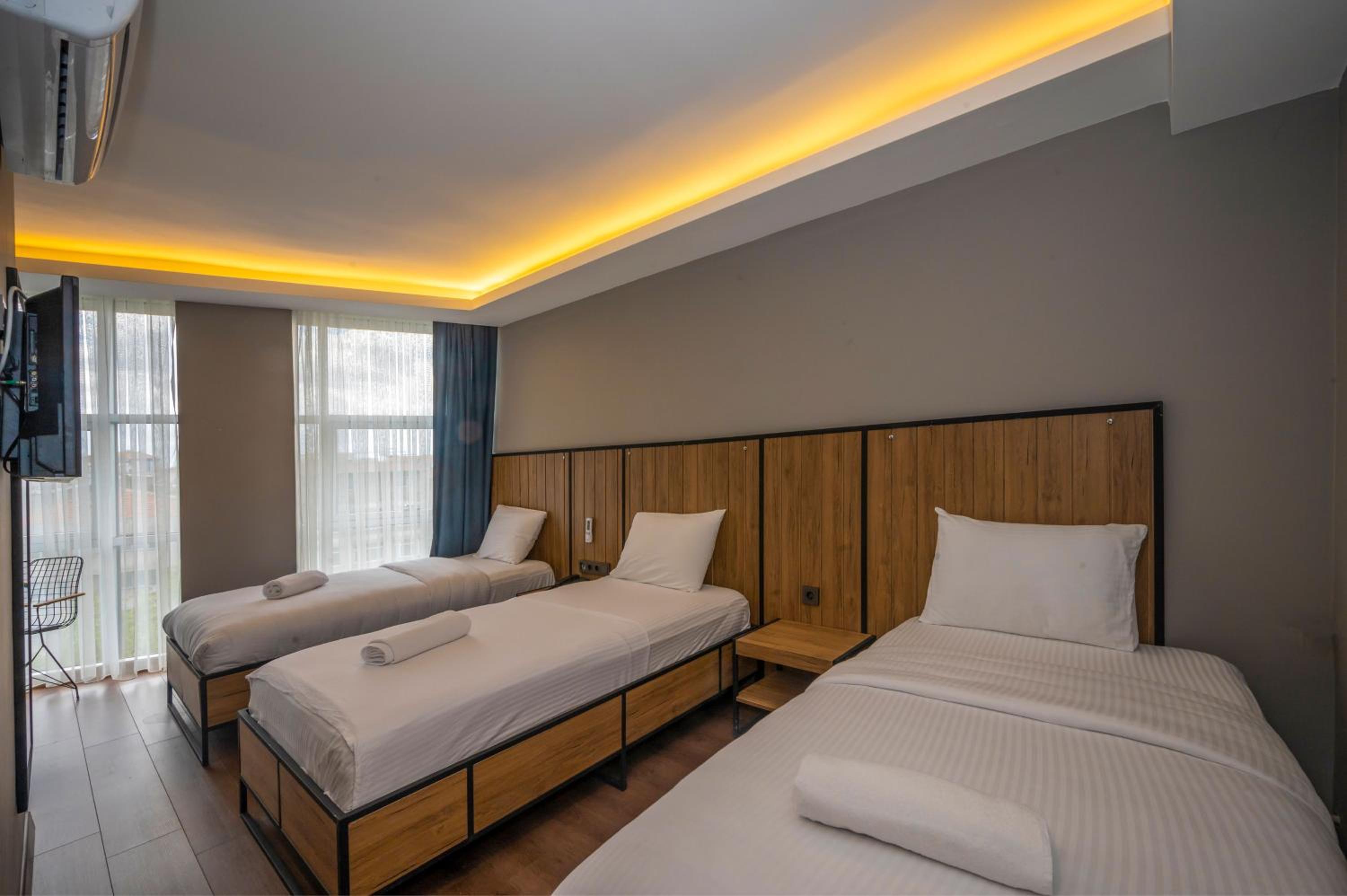 Deluxe Triple Room - Photo 9