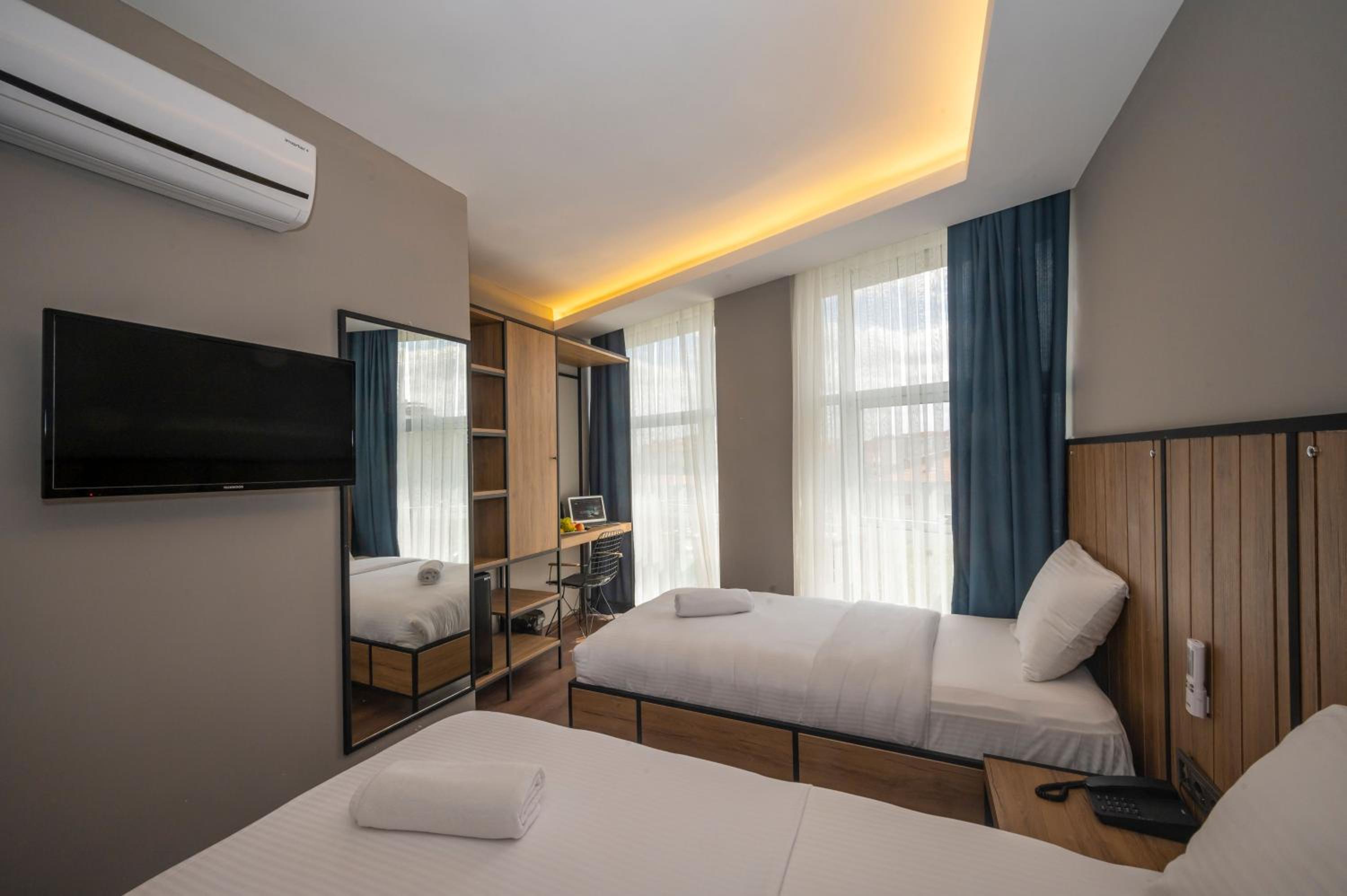 Deluxe Triple Room - Photo 14