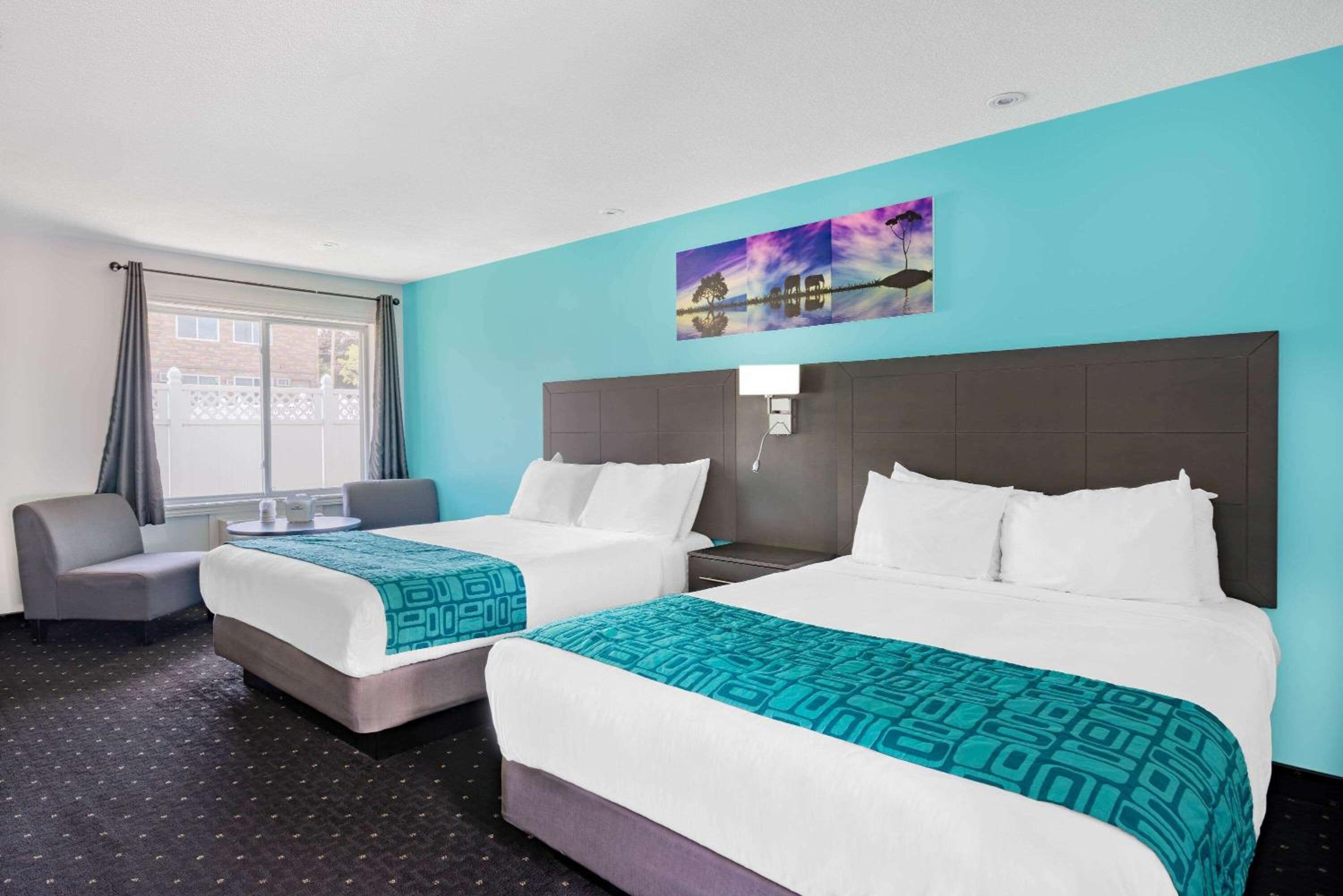 Queen Room with Two Queen Beds - Non-Smoking - Photo 1