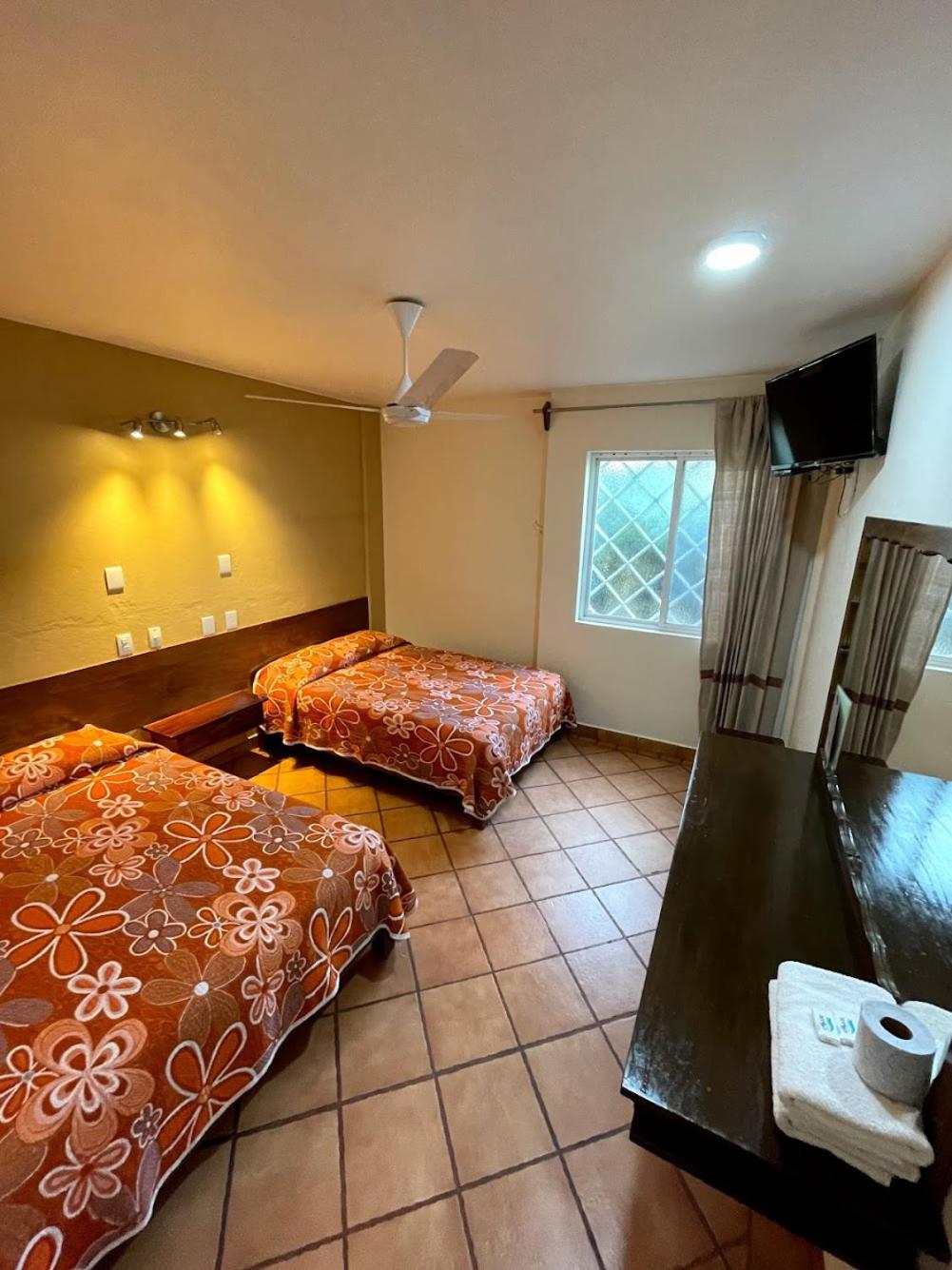 Standard Queen Room with Two Queen Beds - Photo 1