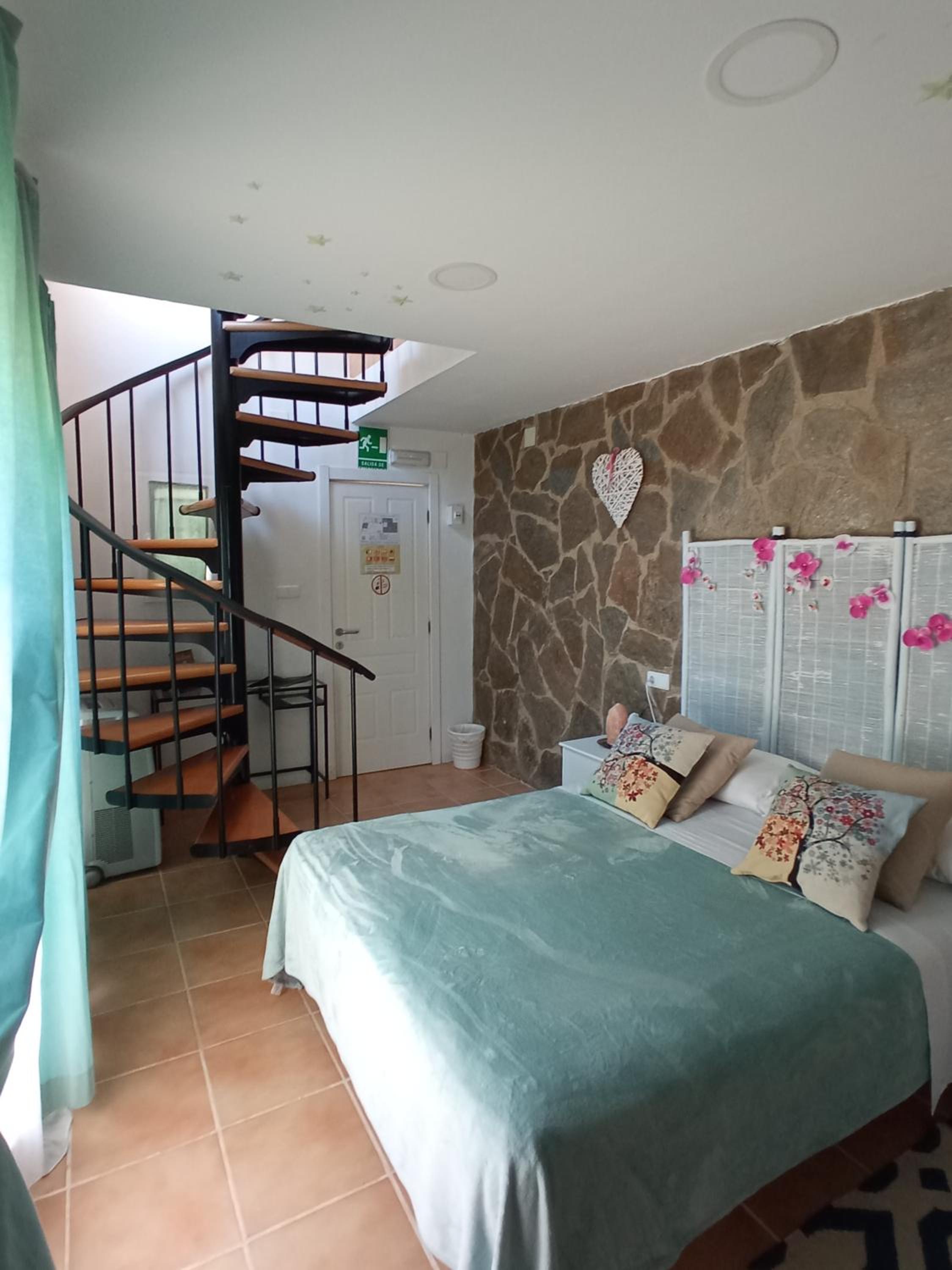 Habitación Spa Deluxe con cama Queen.