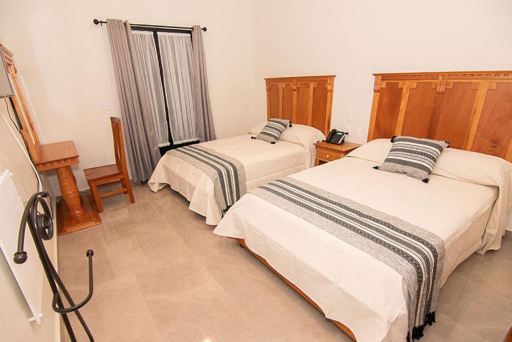 Deluxe Queen Room with Two Queen Beds - Photo 1