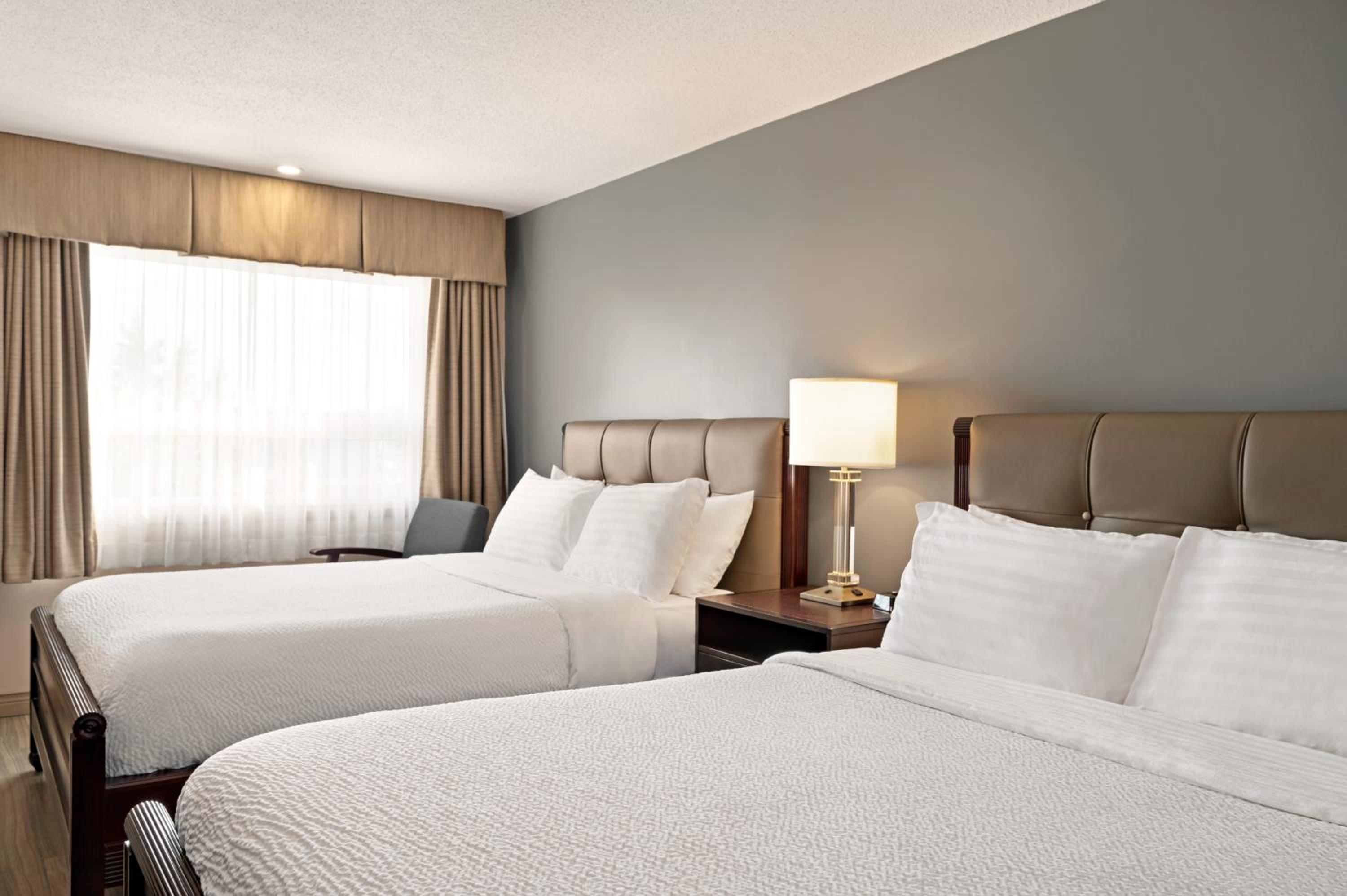 Queen Room with Two Queen Beds - Non-Smoking - Photo 1