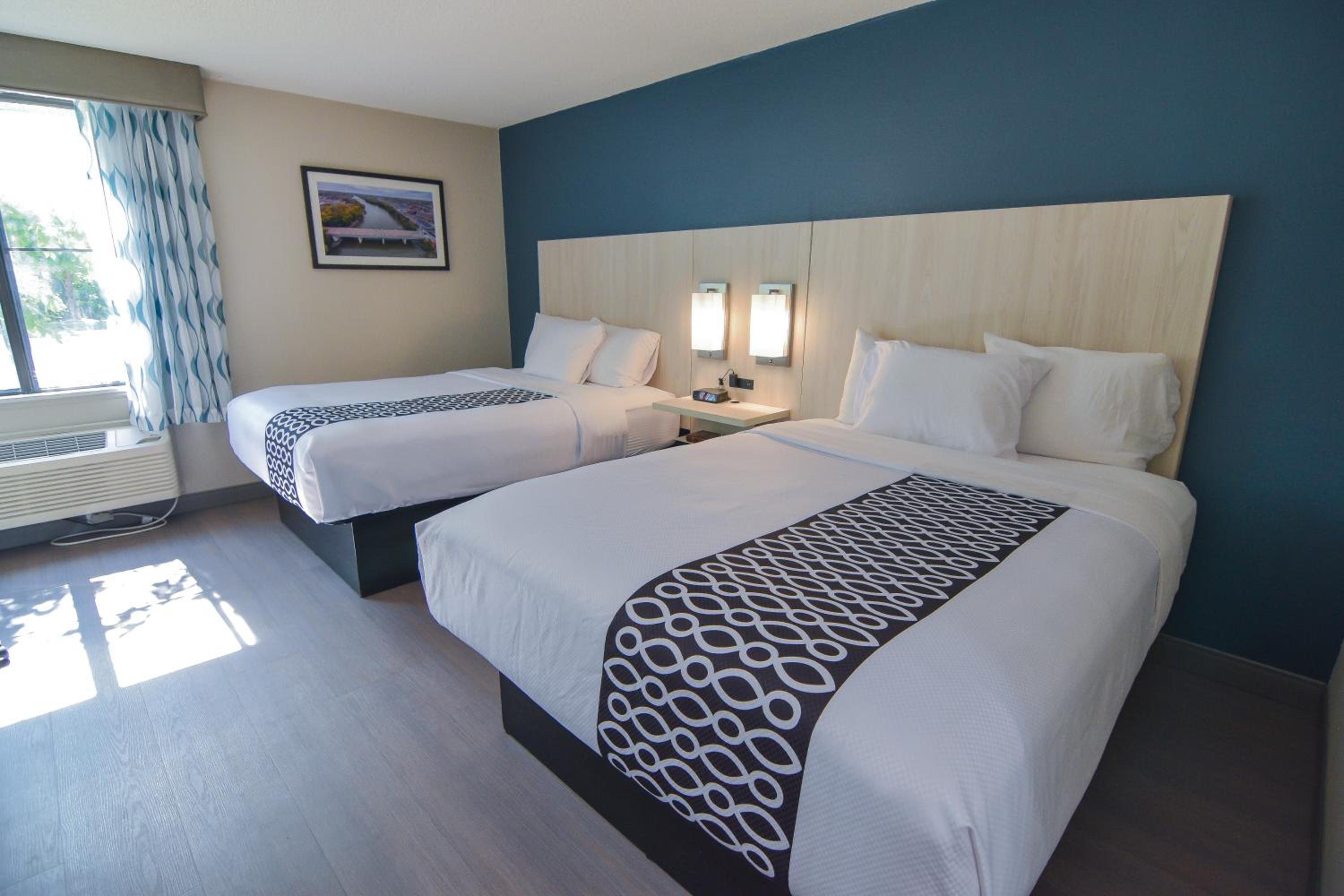 Queen Room with Two Queen Beds - Photo 1
