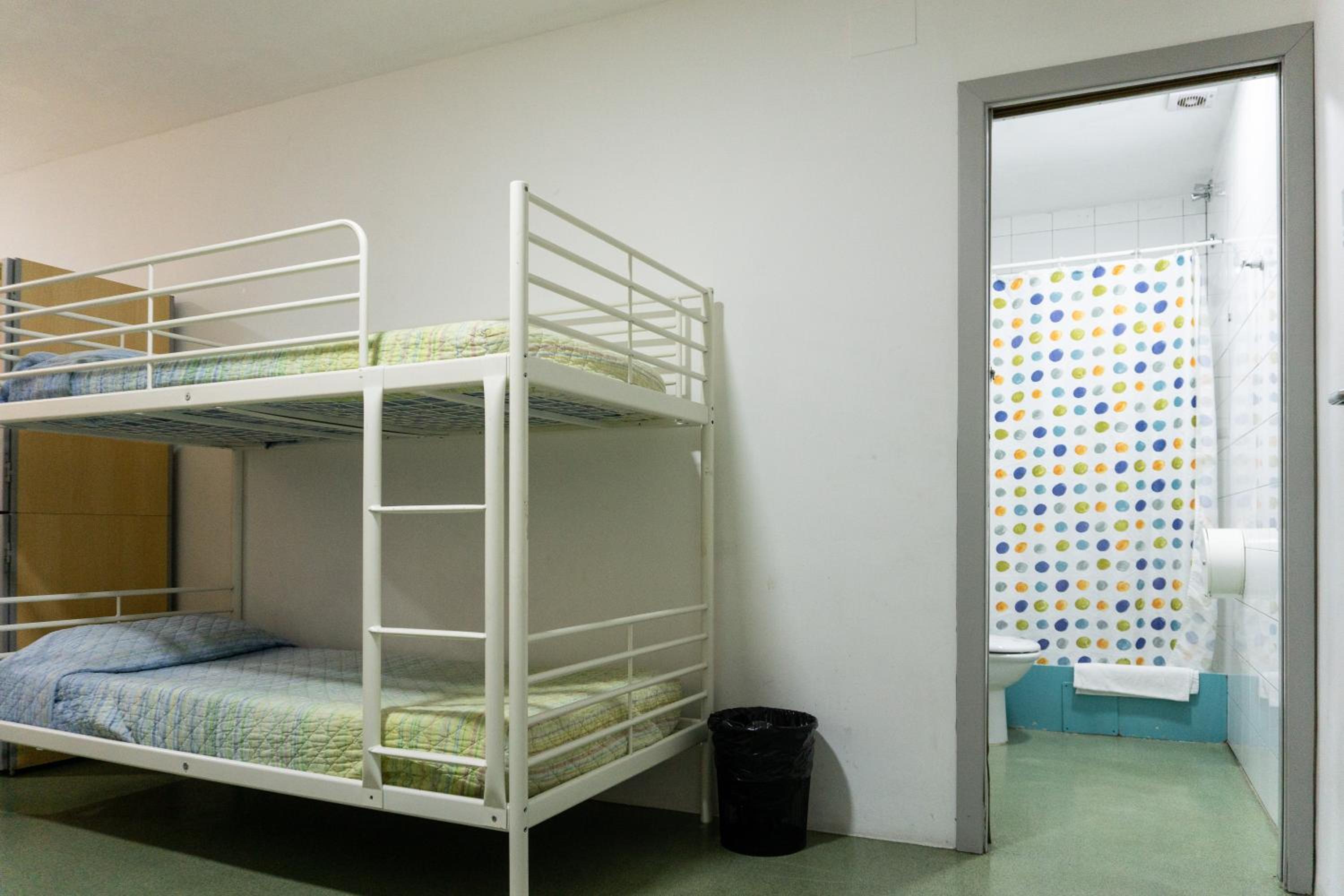 bed in 8-bed dormitory with private bathroom photo 3