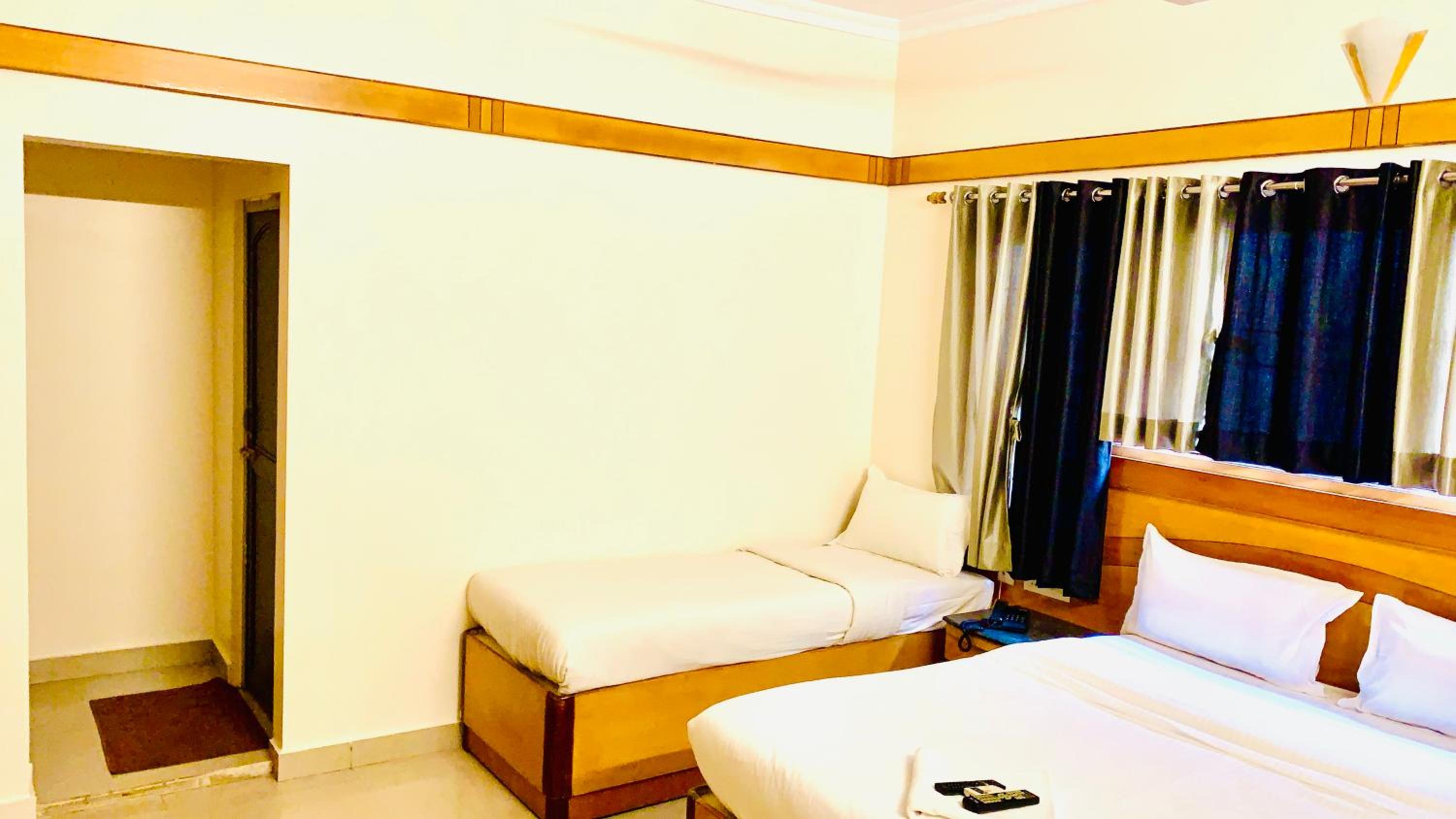 Deluxe Triple Room - Photo 11