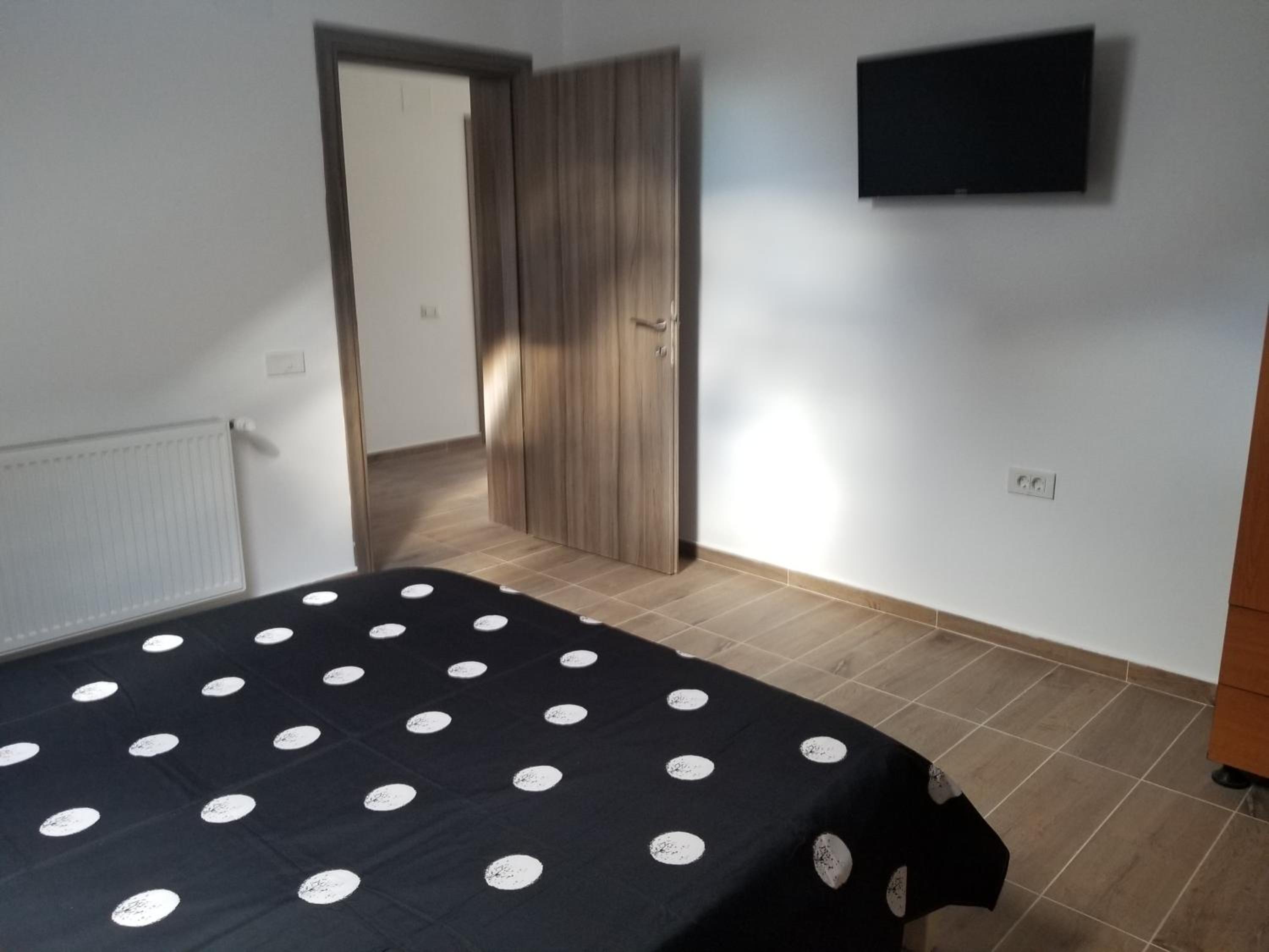 Three-Bedroom Apartment - Photo 40