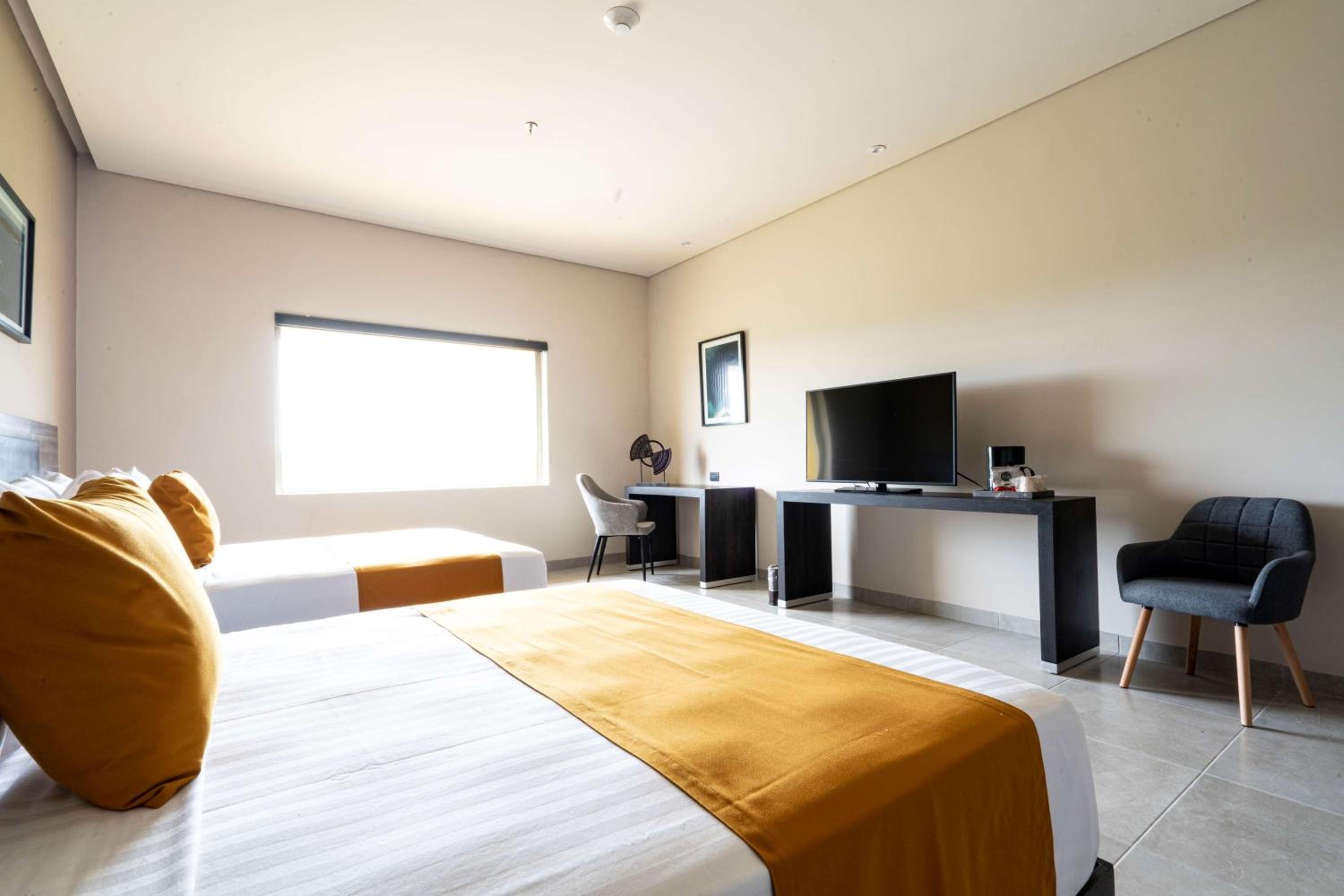 Standard Queen Room with Two Queen Beds and Partial View - Photo 1
